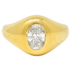 Cartier 1960's 1.22 CTW Oval Cut Diamond 18 Karat Yellow Gold Unisex Signet Ring