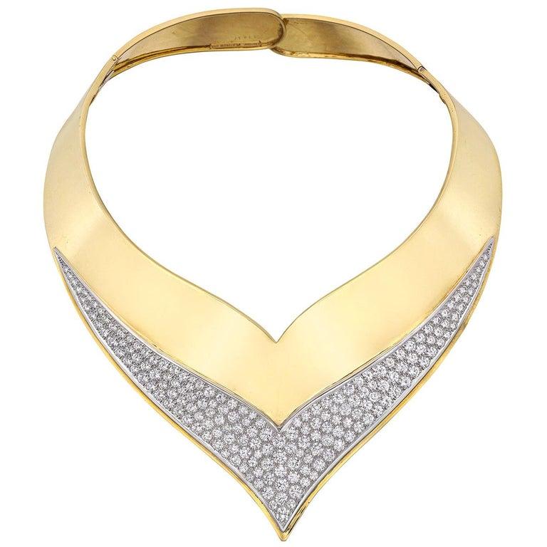 Vintage collar necklace, designed in polished 18k yellow gold with a pavé diamond front section set in platinum.

Numbered '11317' and signed 'Cartier'
Diamonds weighing ~18.48 total carats (D-F color, VVS1-VVS2 clarity)
Circa 1960s