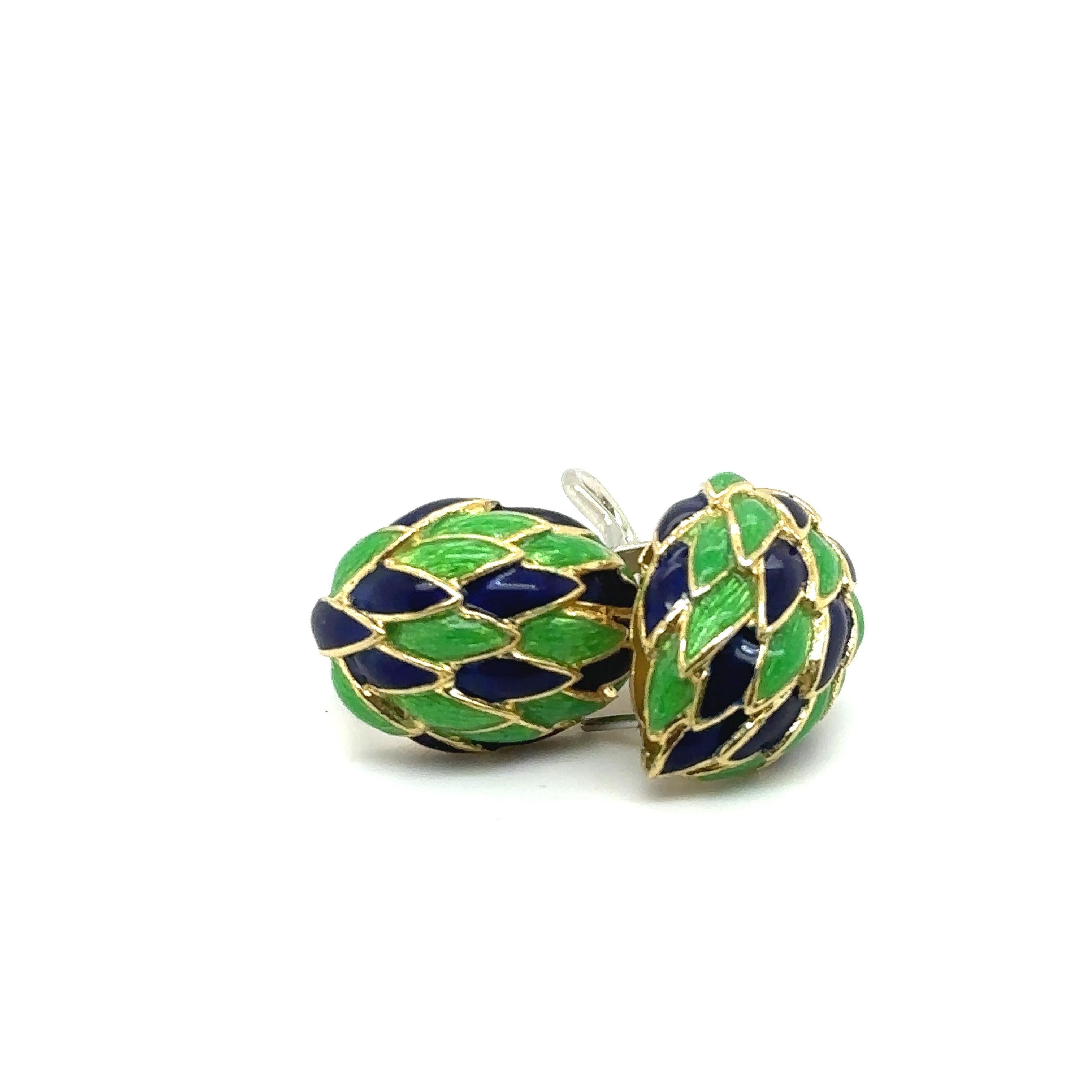 This beautiful Cartier earrings from the 1960s are made of 18kt yellow gold and of blue and green guilloché enamel scales. 
Signed 'CARTIER ITALY' Numbered '54915'
Comes with original Cartier pouch. 
The piece was brought to the Cartier boutique in