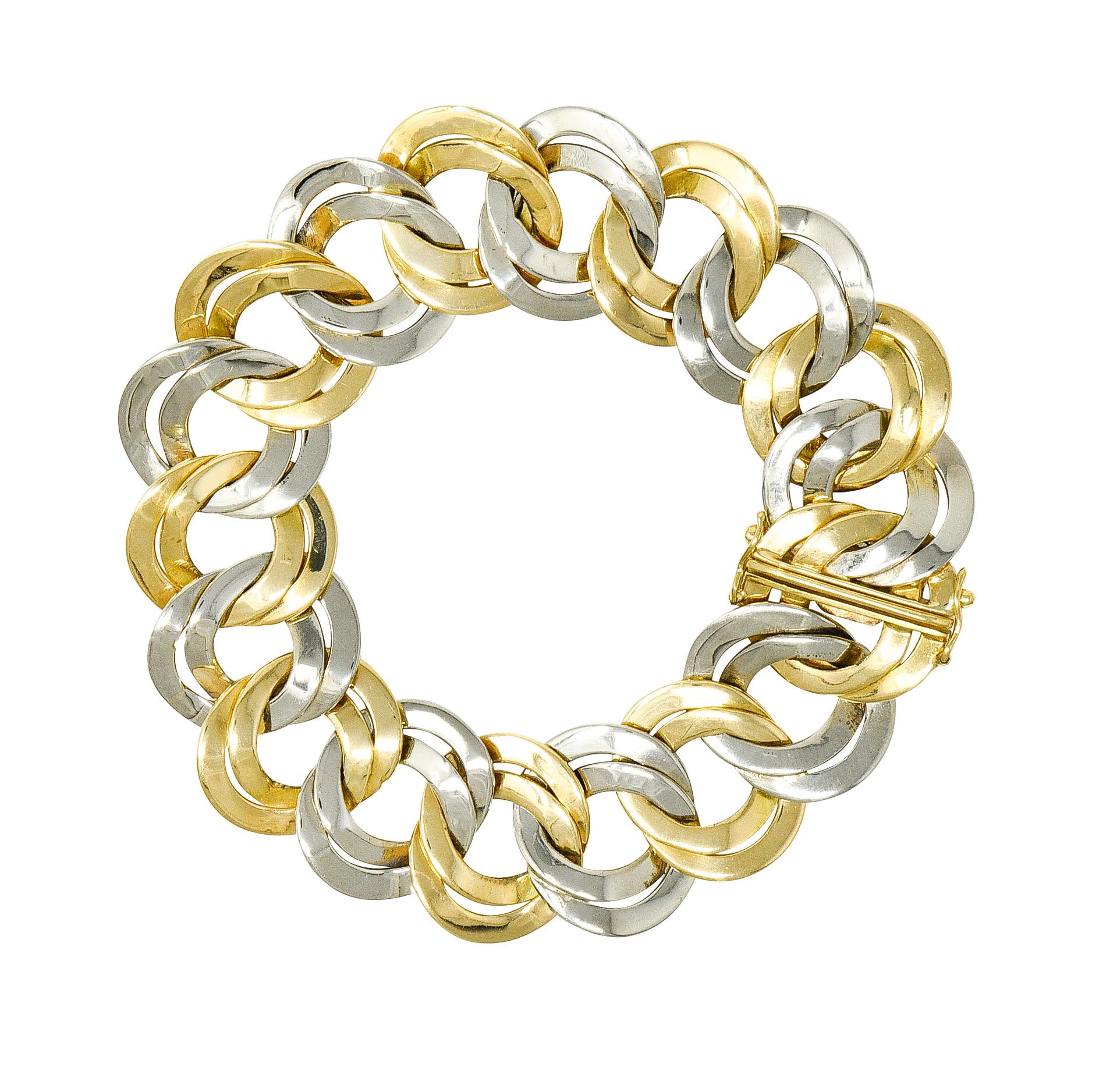 Designed as a curb link bracelet with doubled round links. Alternating between yellow gold and platinum. Accented by high polished finish. Completed by hidden clasp closure with double hinged safety. Tested as 18 karat gold and platinum. Numbered