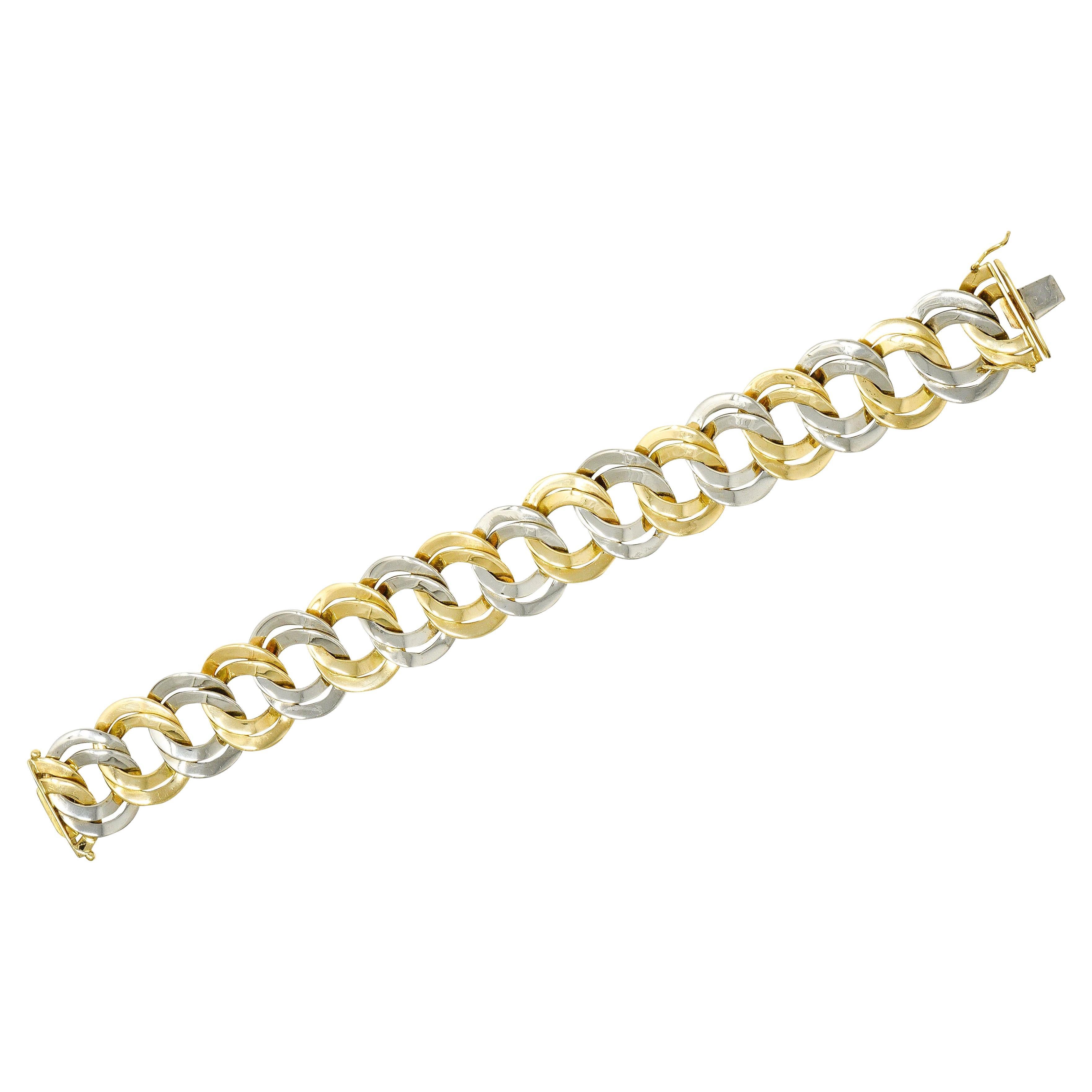 Cartier 1960er Jahre 18 Karat zweifarbiges Gold-Gliederarmband mit doppelter Kurbelkette