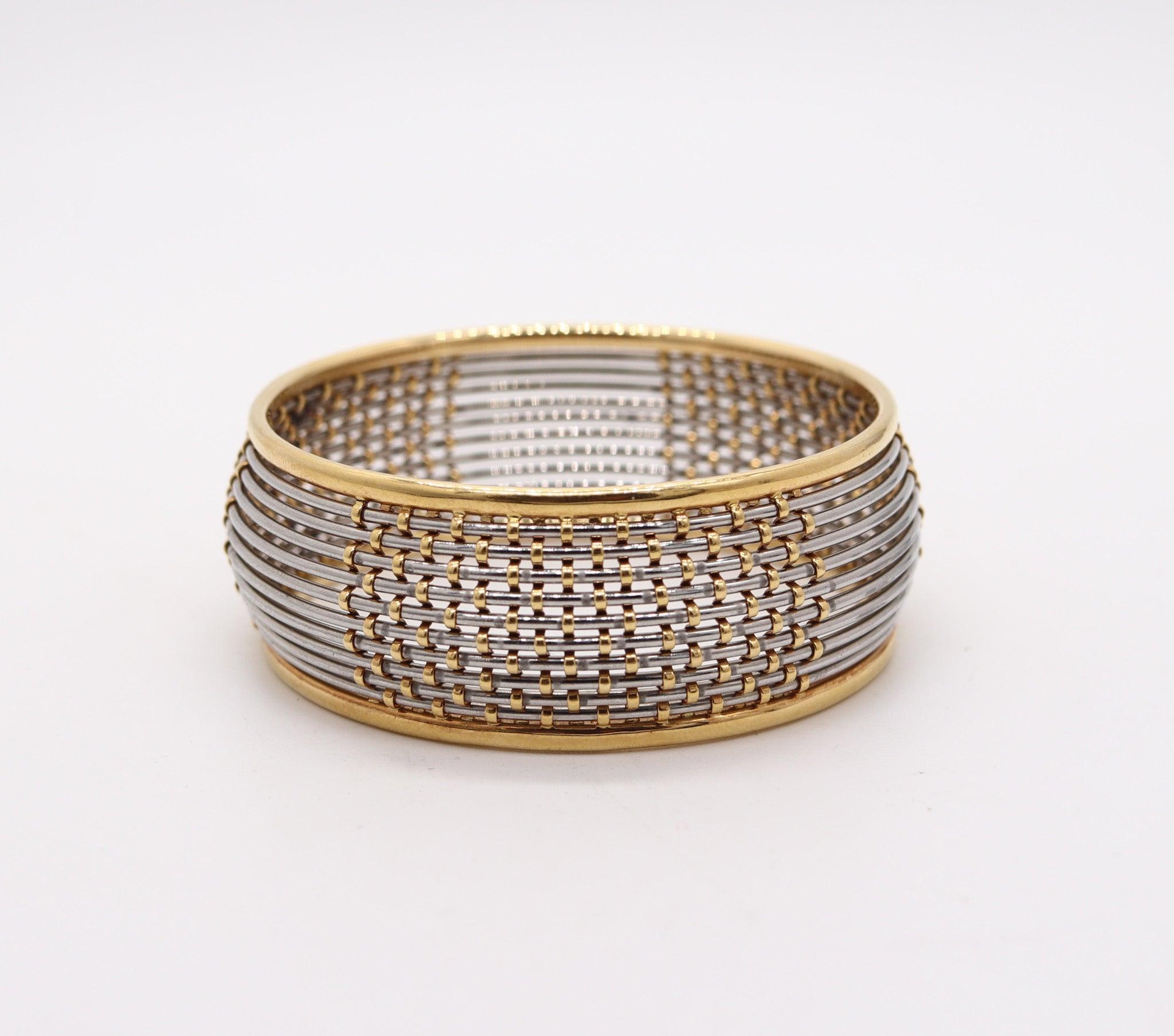 A bangle bracelet designed by Cartier.

This is a very rare modernist bangle bracelet created by the French jewelry house of Cartier, back in the 1970.The bangle was masterfully crafted with geometric patterns in solid yellow gold of 18 karats and