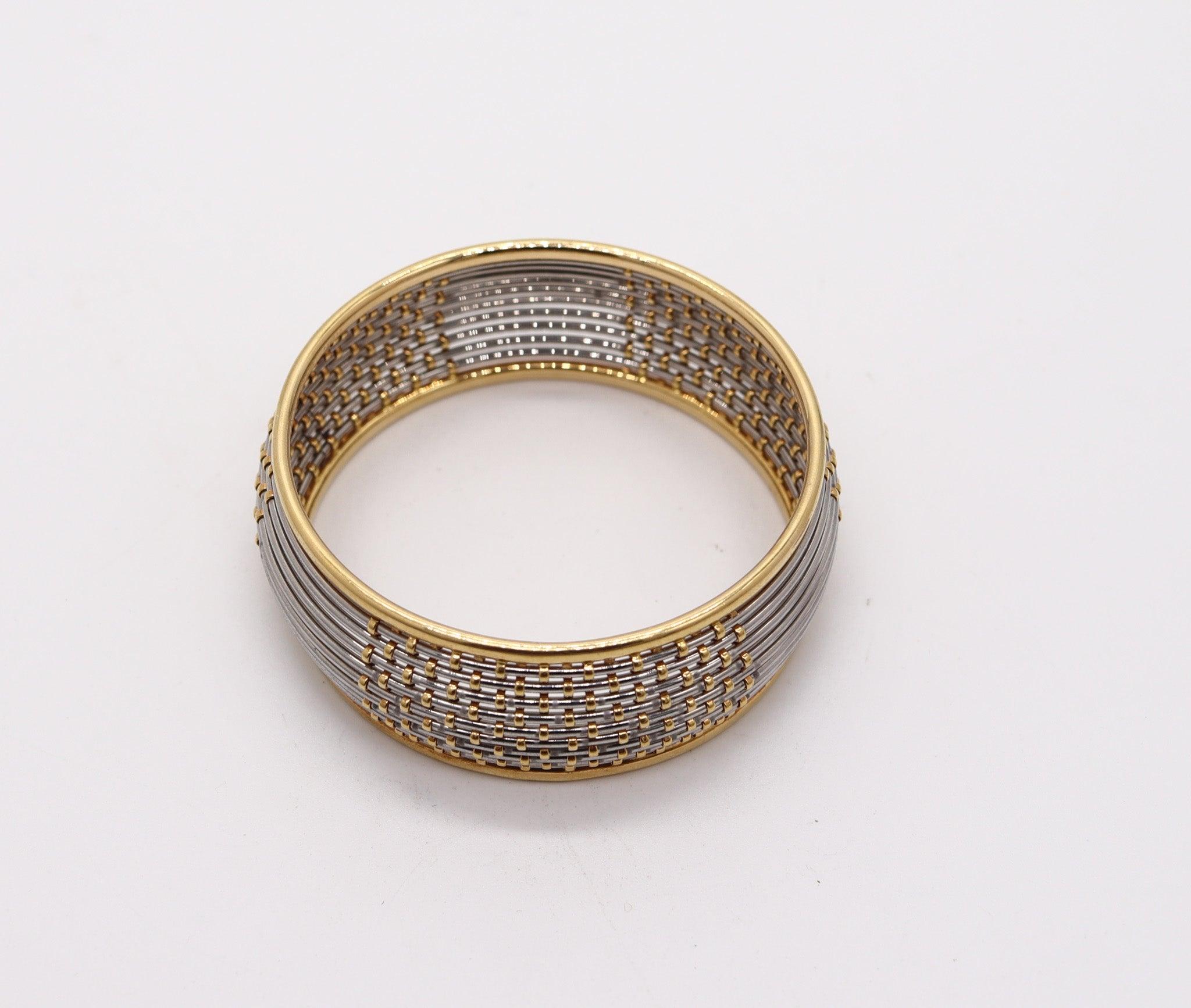 Modernist CARTIER 1970 Geometric Bangle Bracelet In 18Kt Yellow Gold And Steel For Sale