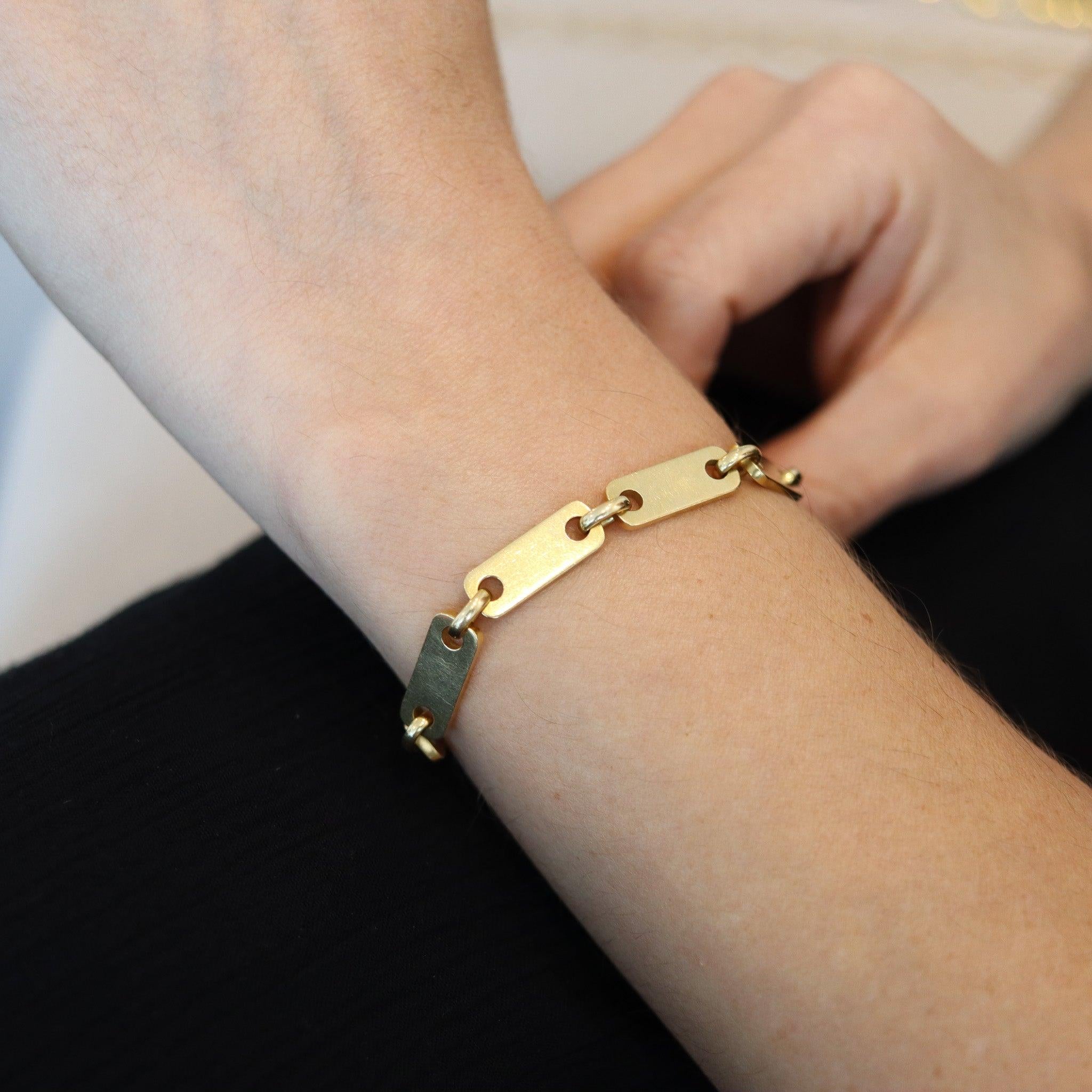 Figaro-Plaquette bracelet designed by Cartier.

This is a very rare and unusual bracelet, created by the jewelry house of Cartier, back in the 1970s. This links of this bracelet has been originally designed by Georges L'Enfant IN 1966 and is crafted