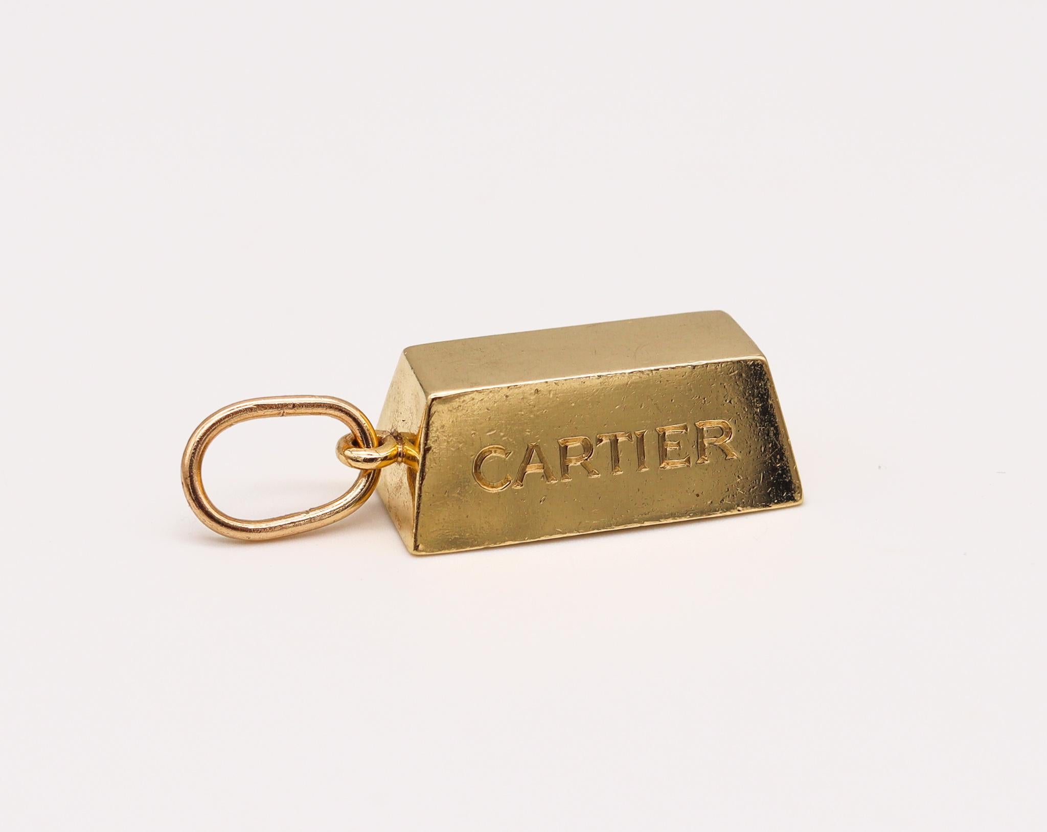 An ingot pendant charm designed by Cartier.

An oversized gold ingot, created by the house of Cartier back in the 1970's. This is an iconic piece from the modernism period crafted in solid yellow gold of 18 karats with high polished finish. Fitted