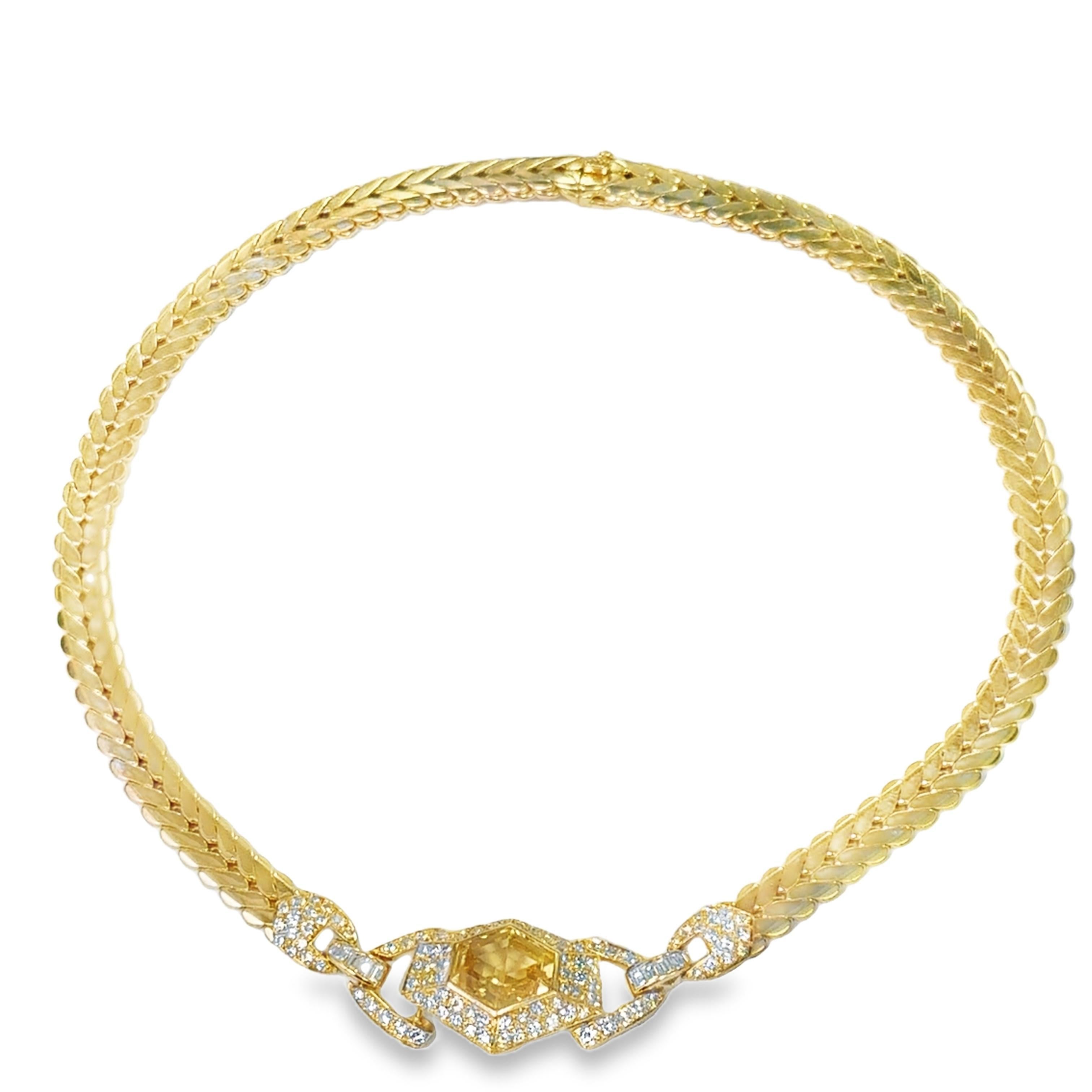 Like sunlight caught in a clasp at the throat

This 1970 Cartier necklace is not worn—it is possessed. A bold composition of weight and radiance, it centers on a trapezoid-cut yellow sapphire weighing approximately 9.0 carats, luminous and golden as