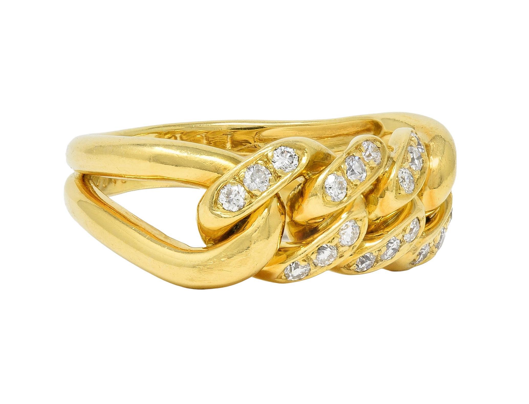 Centering a row of Cuban chain links bead set with round brilliant cut diamonds
Weighing approximately 0.54 carat total - G color with VS2 clarity
Flanked by open loop motif shoulders 
Completed by grooved shank
Tested as 18 karat gold
Numbered and