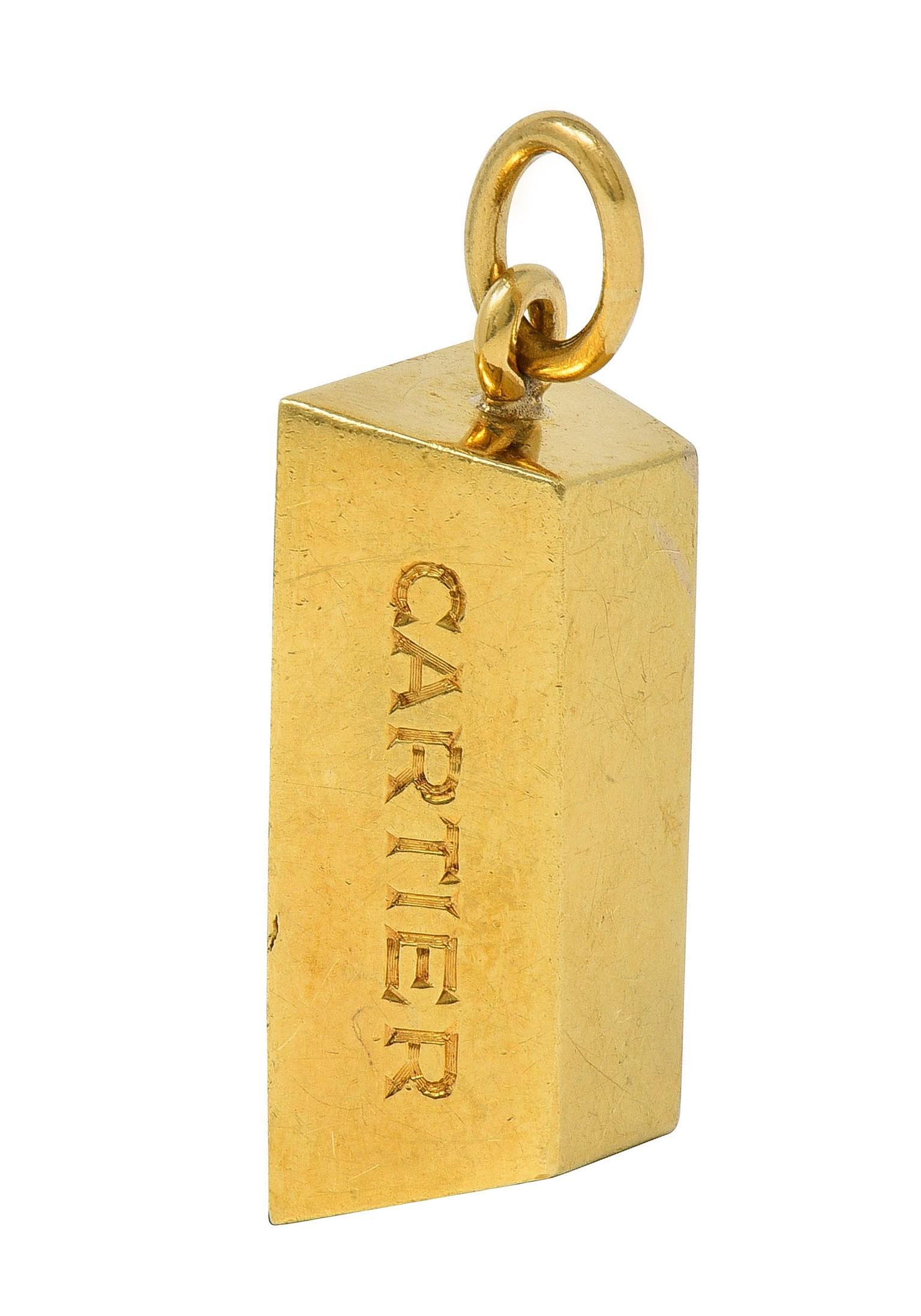 Designed as a classic gold brick form weighing 1 oz.
Suspending form jump ring bale
Inscribed on sides with '1 oz.' and 'Cartier'
Stamped for 18 karat gold
Fully signed for Cartier
Circa: 1970s
Measures: 1/2 x 1 1/4 inches - including bale
Total