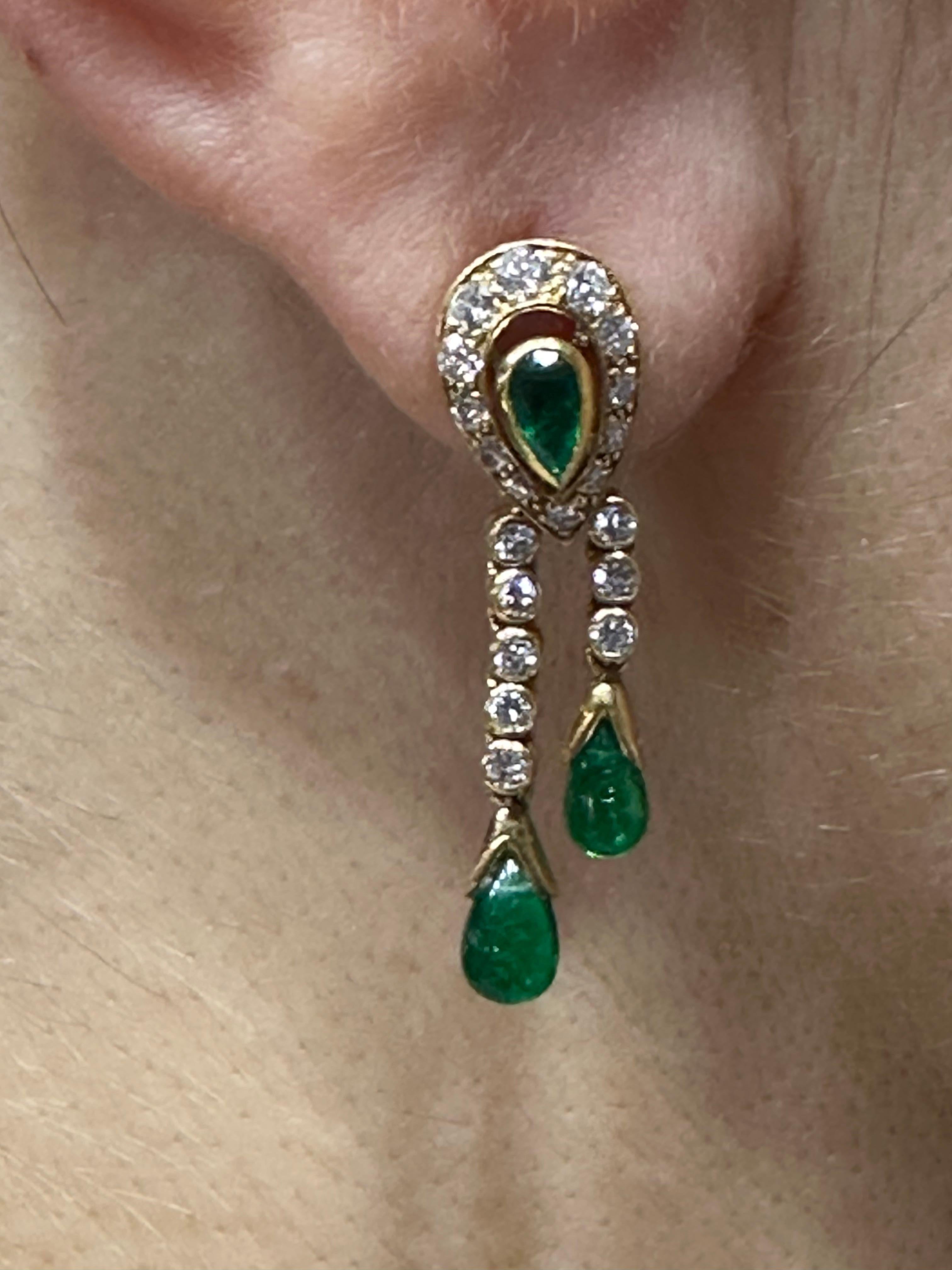 This charming pair of diamond and emerald Cartier earrings dates back to 1970s and were made by Cartier, Paris. The emeralds are Colombian and have a beautiful colour. Although not large in size, the quality of the stones and the superior