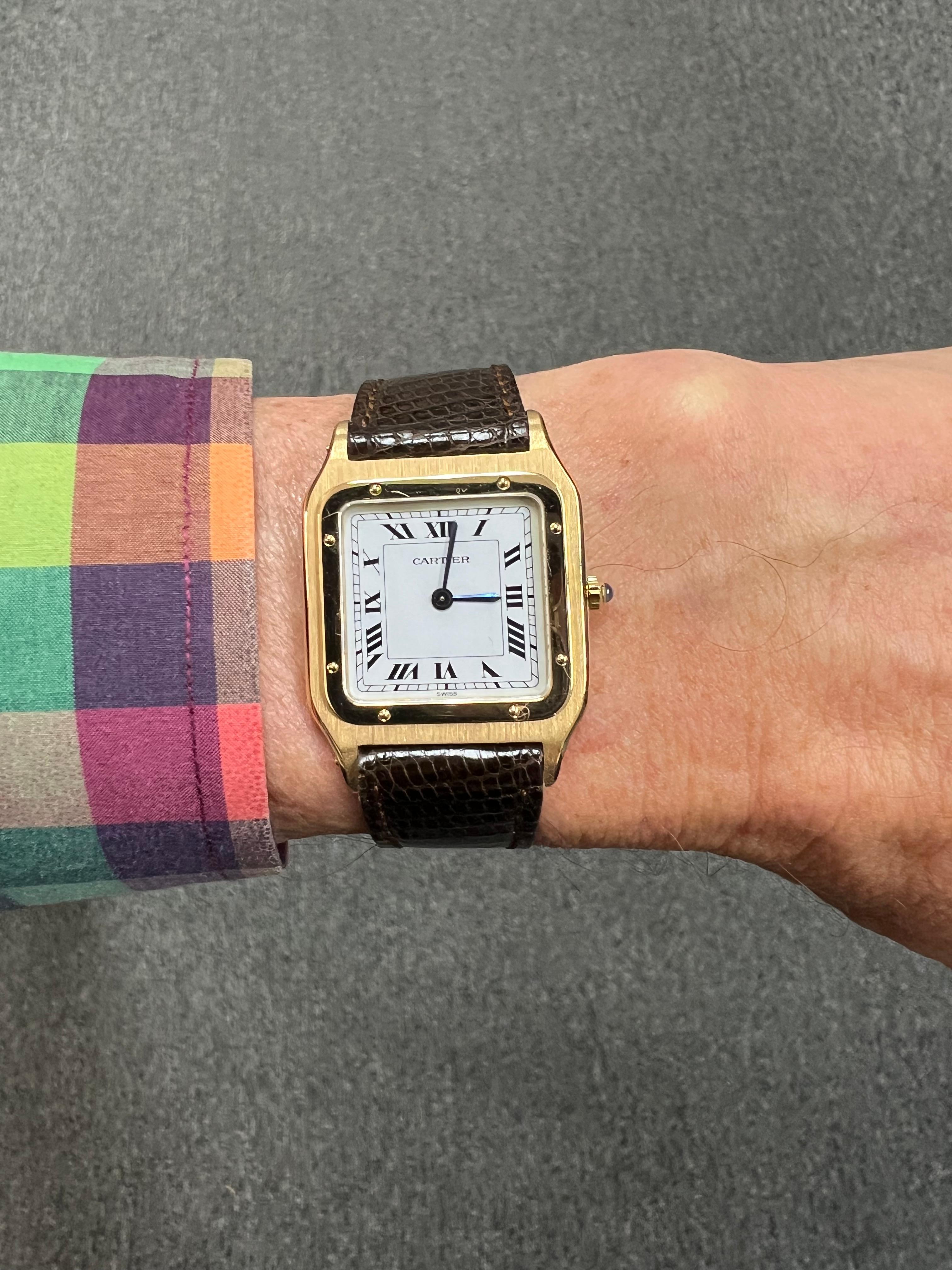 1970s Cartier Santos Dumont manual wind 18k yellow gold wristwatch.

The 1970s Cartier Santos Dumont Manual Wind 18K Yellow Gold Wristwatch epitomizes the fusion of elegance and functionality that has defined Cartier's legacy. This timepiece,