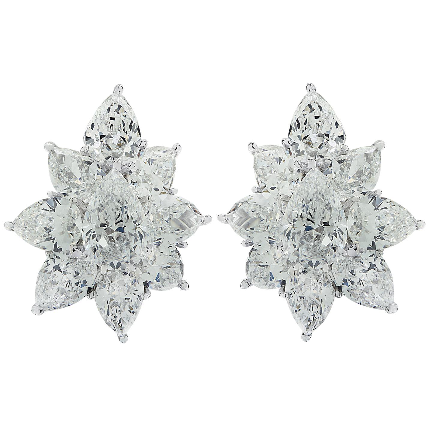 From the House of Cartier, these striking Cartier diamond cluster earrings are hand crafted in platinum, and feature 18 pear shape diamonds weighing 19.80 carats total, D-F color, VS – SI clarity. Each diamond was carefully selected, perfectly