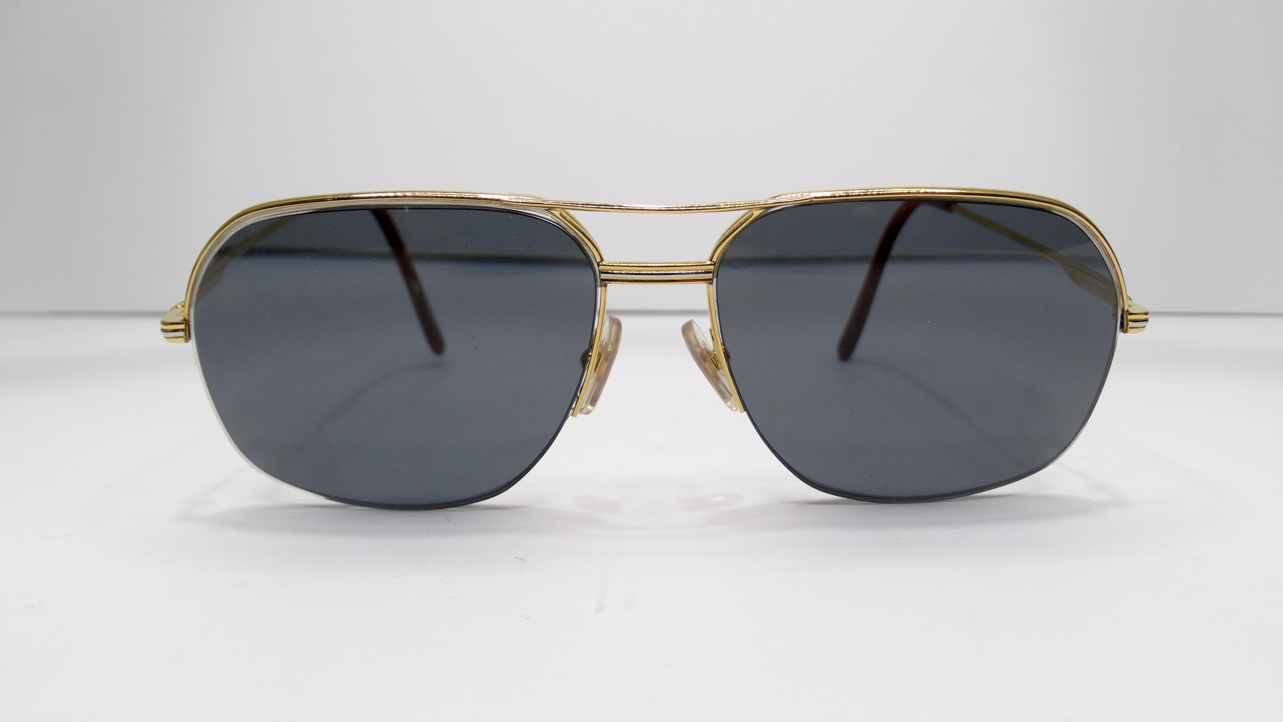 A favorite of both jewelry and fashion lovers, Cartier is always a classic! Circa 1980s, these Orsay aviator sunglasses features a 24kt gold plated frame with small accents of silver for a two-tone finish. Cartier markings throughout, stamped