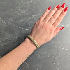 Cartier 1980's Tri-Colored 18 Karat Yellow White Gold Vintage Tubogas Bracelet