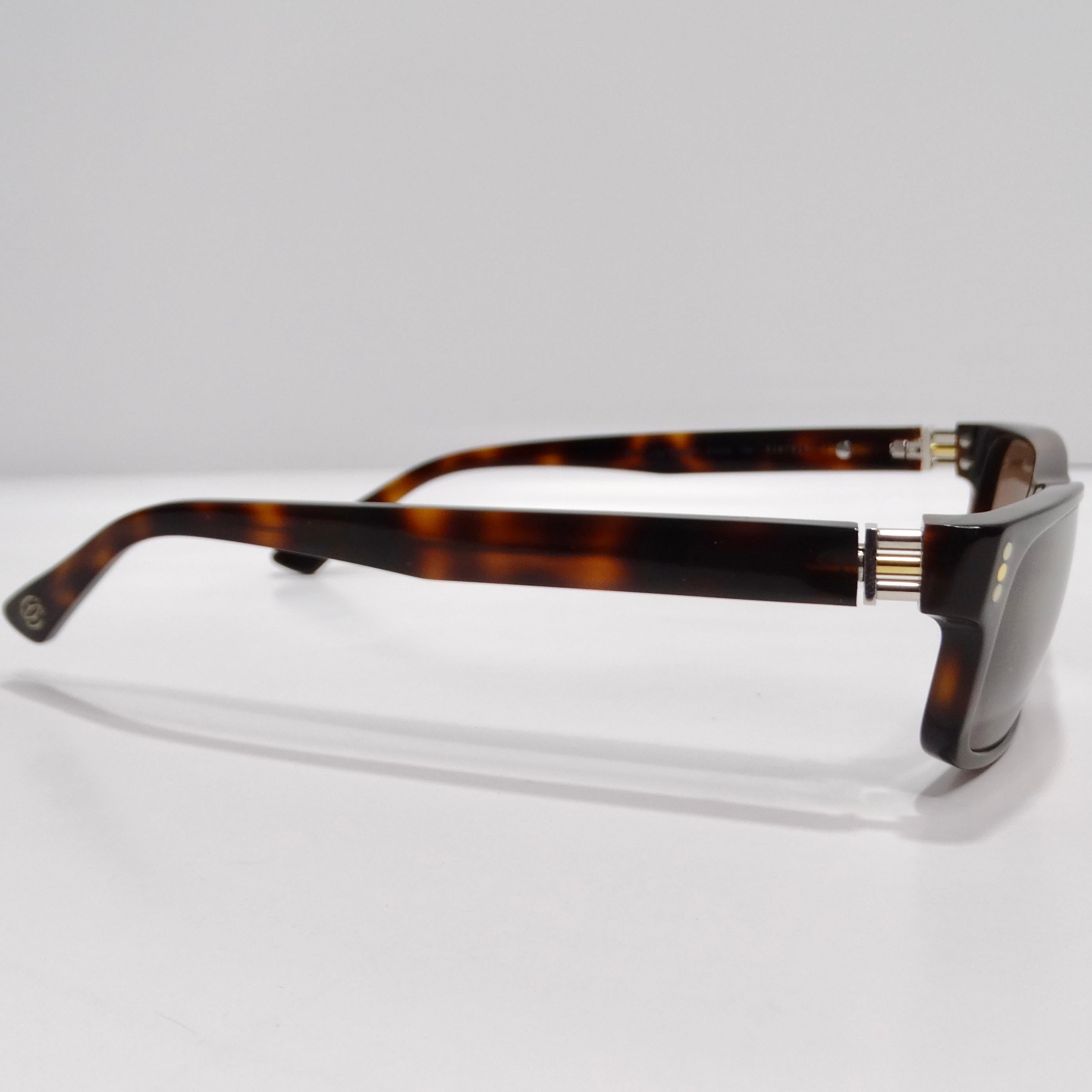 Indulge in timeless elegance with these Cartier 1990s Square Frame Tortoise Shell Sunglasses. Crafted with meticulous attention to detail, these sunglasses exude sophistication and style.

The classic square frame design is complemented by brown