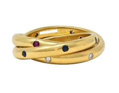 Cartier 1995 French Diamond Sapphire Ruby 18K Gold Vintage Rolling Band Ring