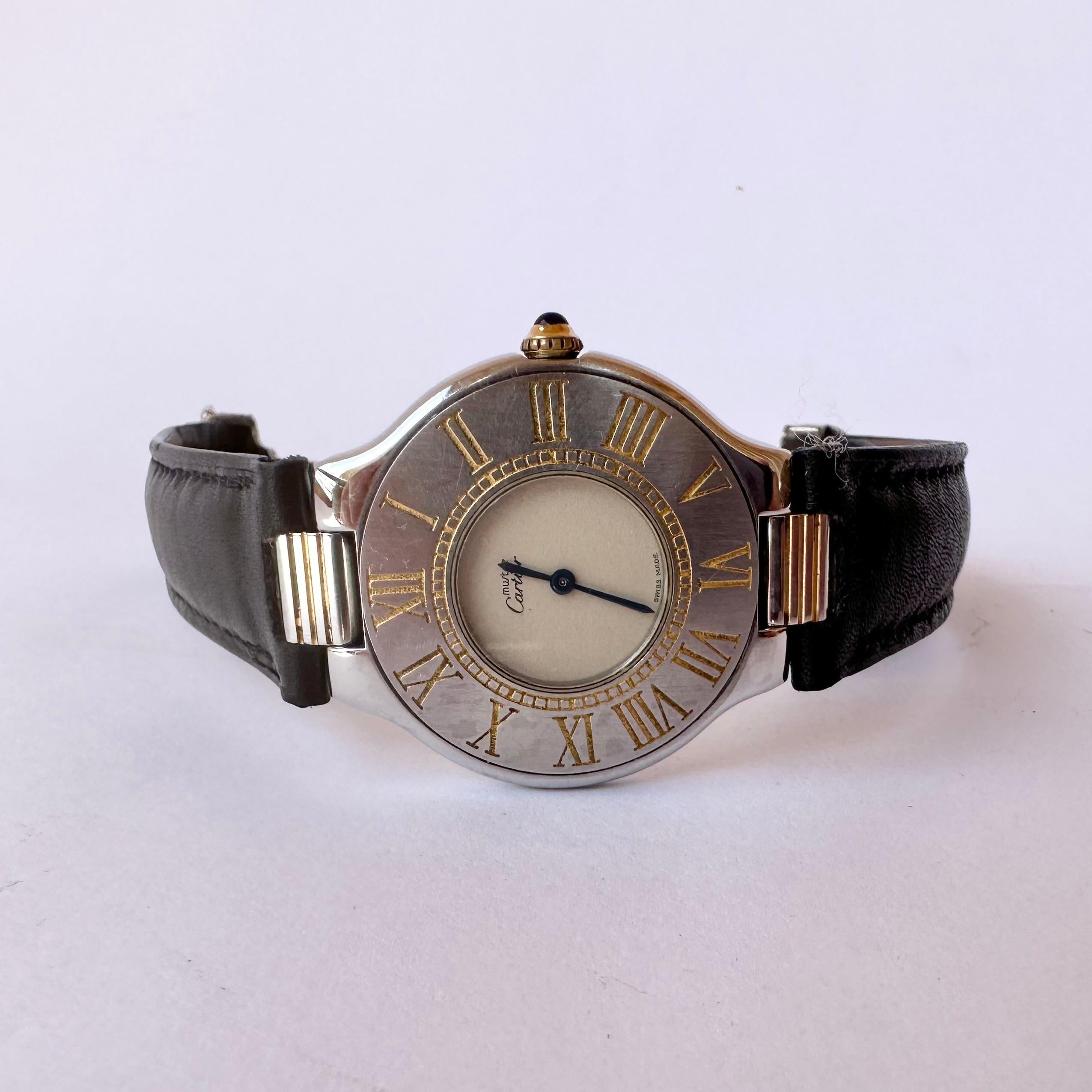 Brand: Cartier

Model: Cartier 21 Must de Cartier

Reference Number: B10310 

Price :650 USD

Country Of Manufacture: Switzerland

Movement: Quartz

Case Material: Leather

Measurements : 31mm (without crown)

Band Type : Gold Plated &Stainless