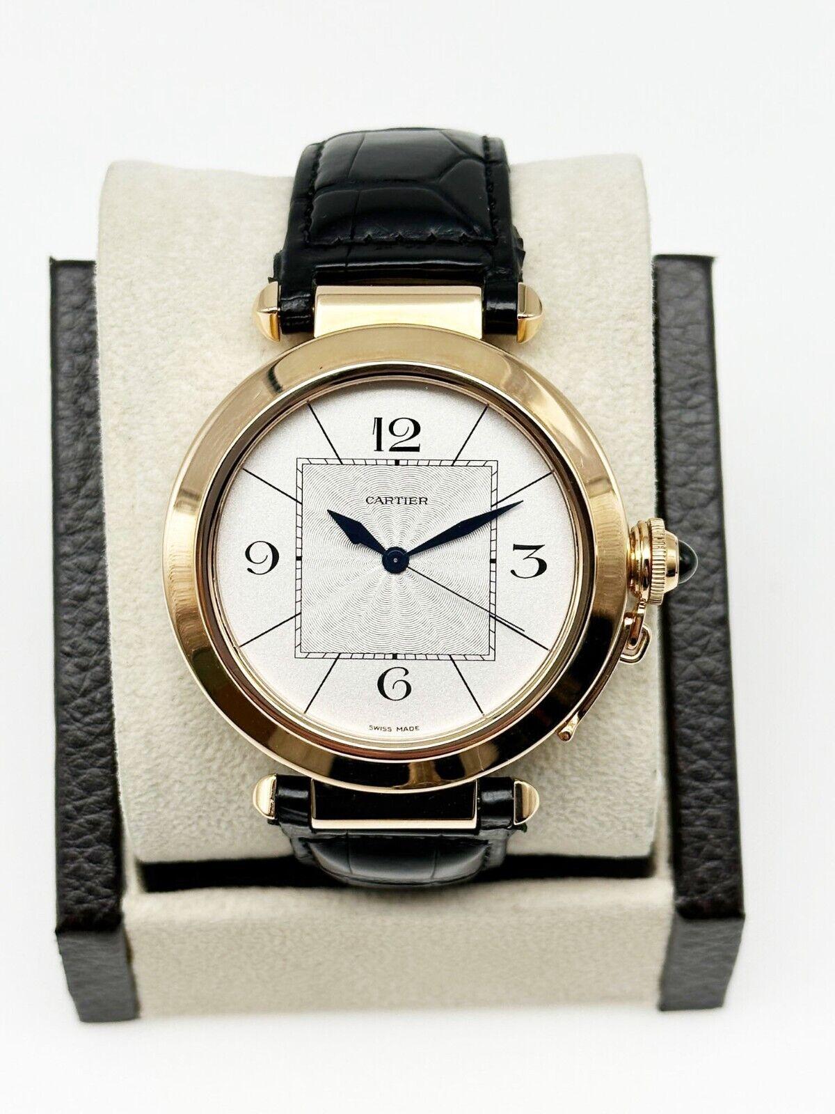 Style Number: 2770
Model: Cartier Pasha 
Case Material: 18K Rose Gold
Band: Black Leather Strap with Original Deployant Clasp
Bezel:  18K Rose Gold
Face: Sapphire Crystal 
Case Size: 42mm 
Includes: 
-Elegant Watch Box
-Certified Appraisal 
-1 Year