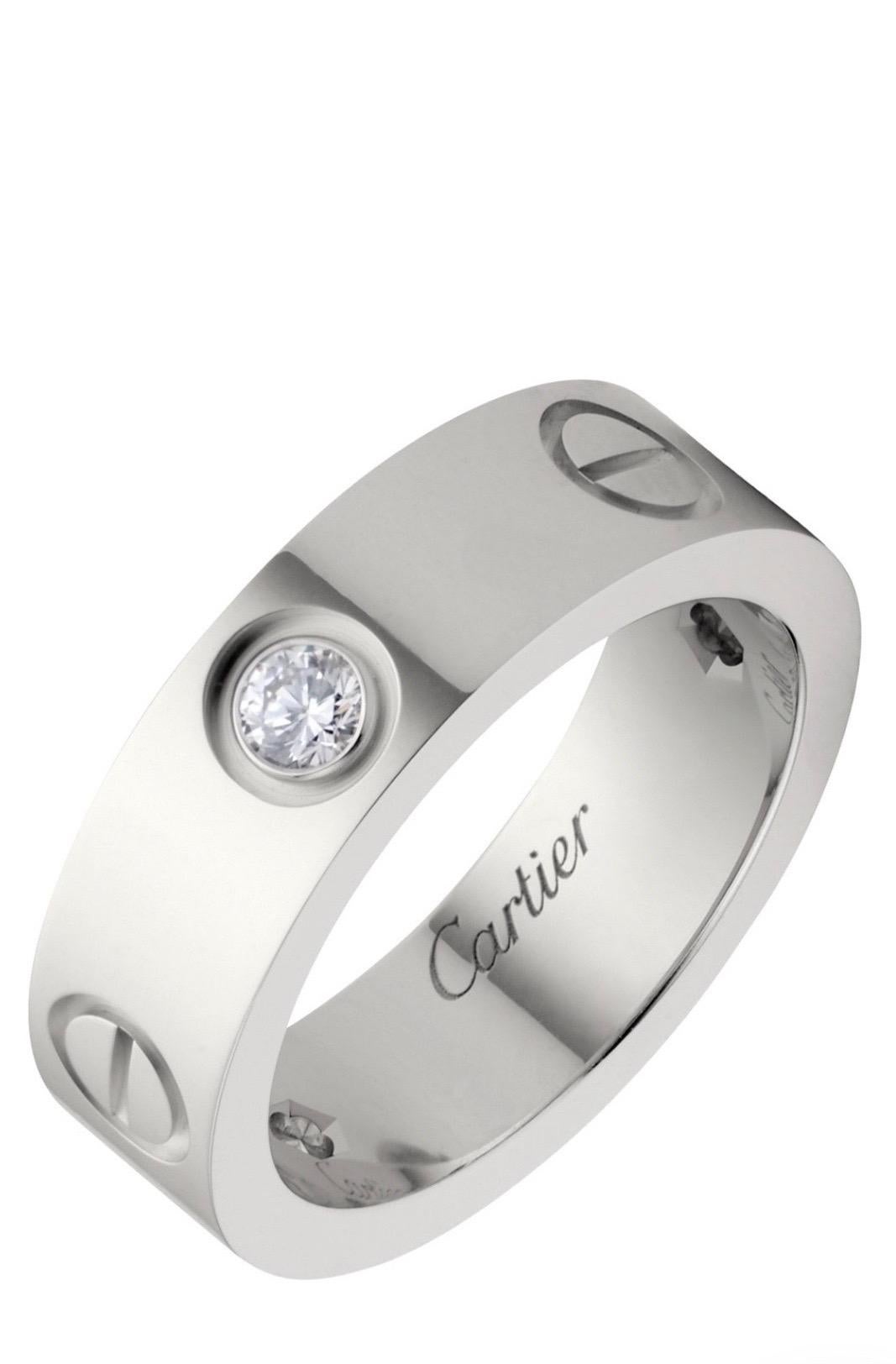 Cartier 3 Diamonds Love Ring 18k White Gold. 
Love ring, 18K white gold, set with 3 brilliant-cut diamonds totaling 0.22 carats. 
Width: 5.5mm. 
Size: 7.5

About The Collection:
A child of 1970s New York, the LOVE collection remains today an iconic
