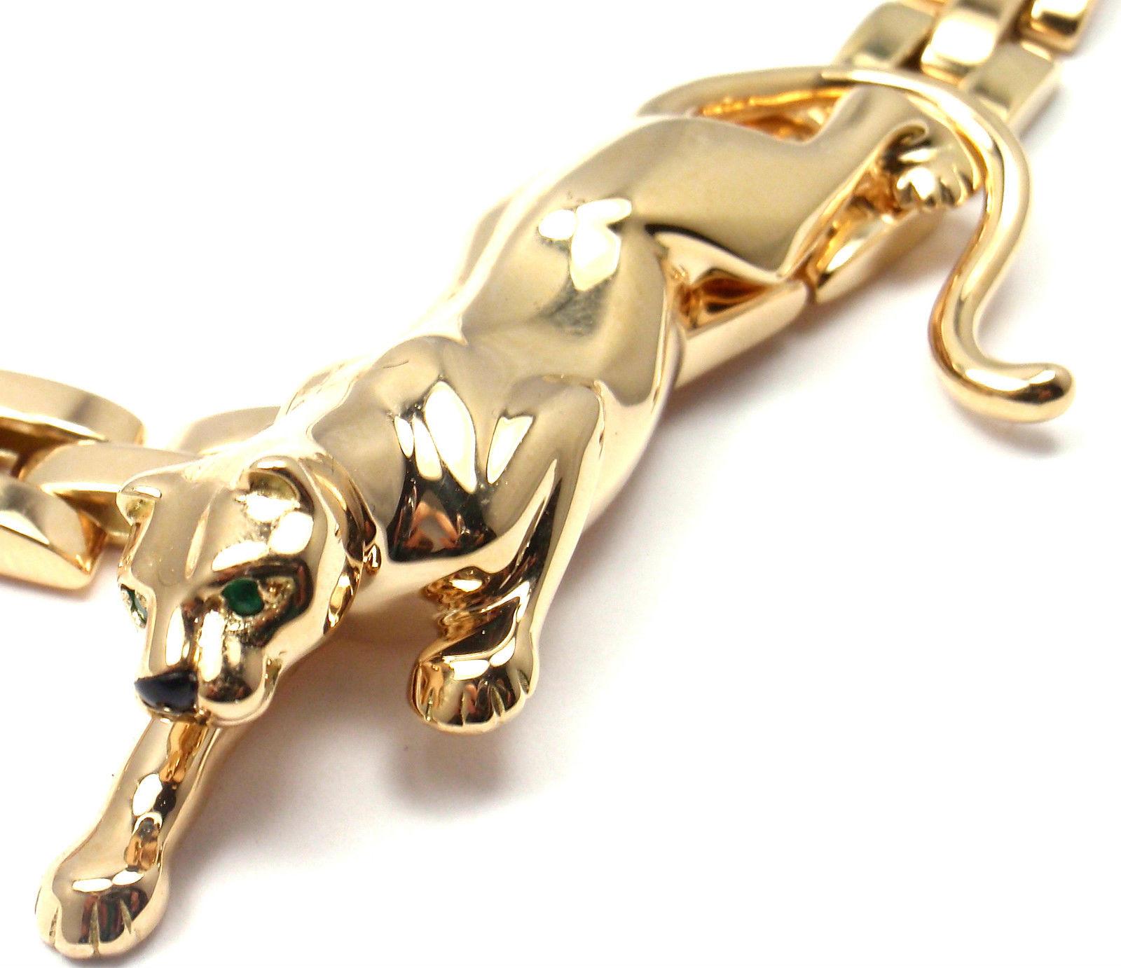 18K Yellow Gold Panthere Panther 3 Row Maillon Necklace by Cartier.  
With an adorable Panther with black onyx nose and 
2 cute green emerald eyes.  
This necklace comes with its original Cartier box.  
Panther Details:  Length: 2