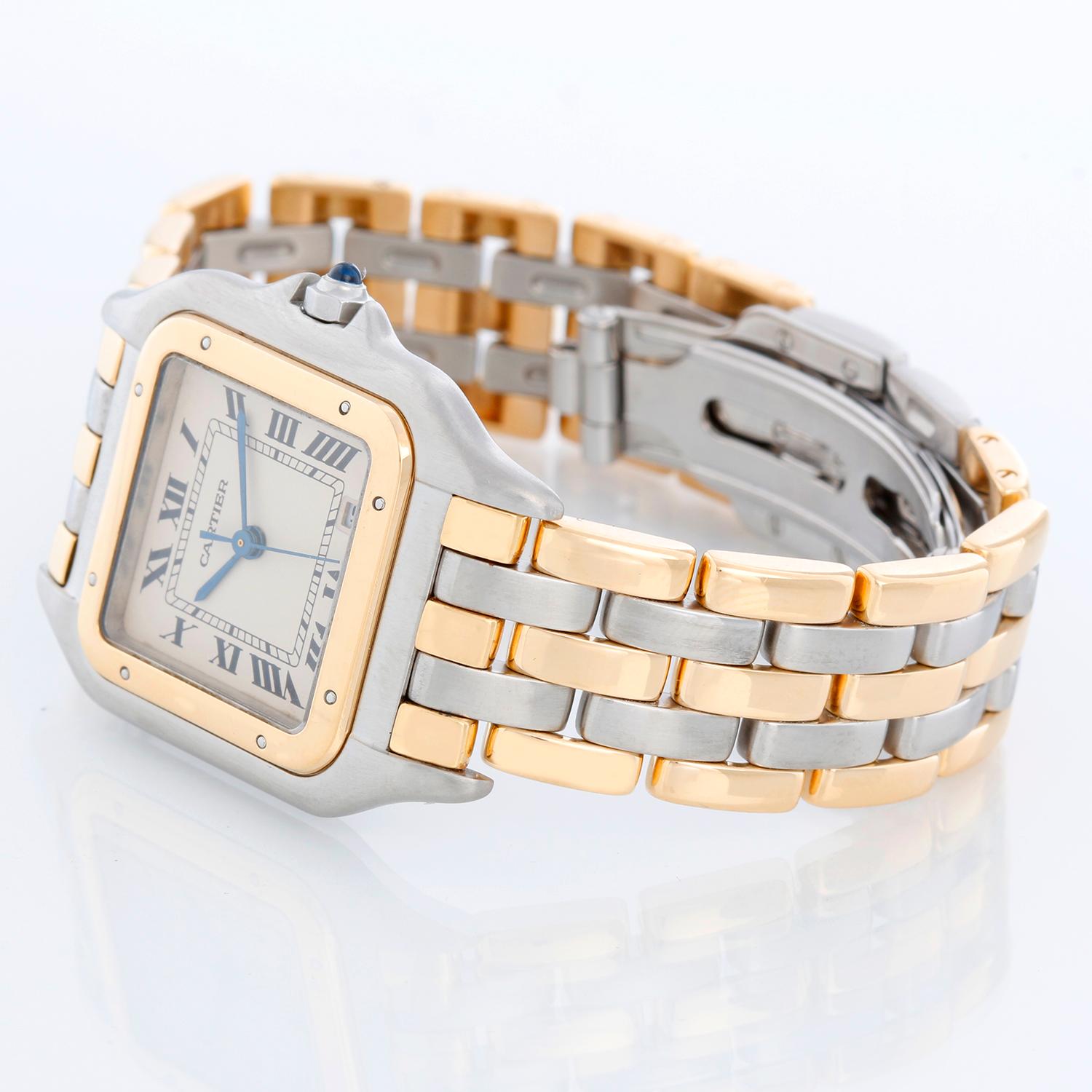 Cartier 3-Row Panther 2-Tone Steel & Gold Watch - Quartz. Stainless steel case with 18k yellow gold bezel (27mm x 37mm). Ivory colored dial with black Roman numerals and date at 5 o'clock. Stainless steel and 18k yellow 3-row Cartier Panther