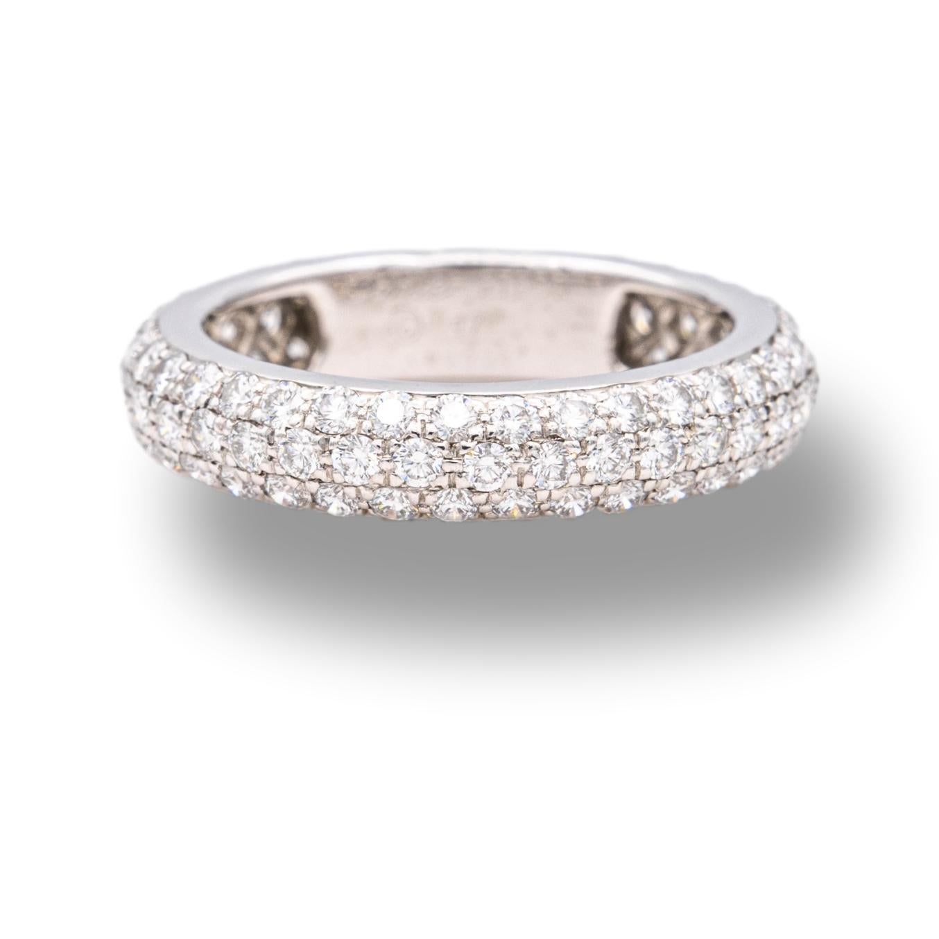 Cartier diamond band ring finely crafted in platinum featuring 3 rows of pave set high-quality round brilliant cut diamonds weighing 1.36 carats total weight. Ring has a domed design and is fully hallmarked. 

Stamp: Cartier PT950 © 47 NB3793