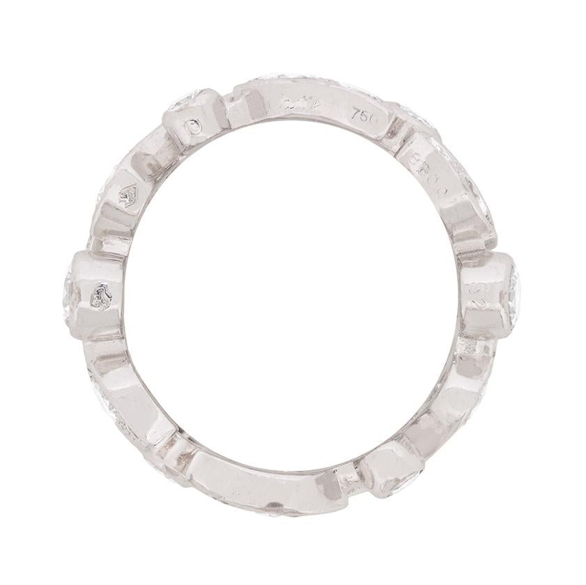 This authentic Cartier diamond ring glitters with 3.60 carats of diamonds arranged in a sculptural foliate motif. Full of fire and set in 18 carat white gold, these round brilliant cut diamonds of various sizes have been graded to a fine E-F colour