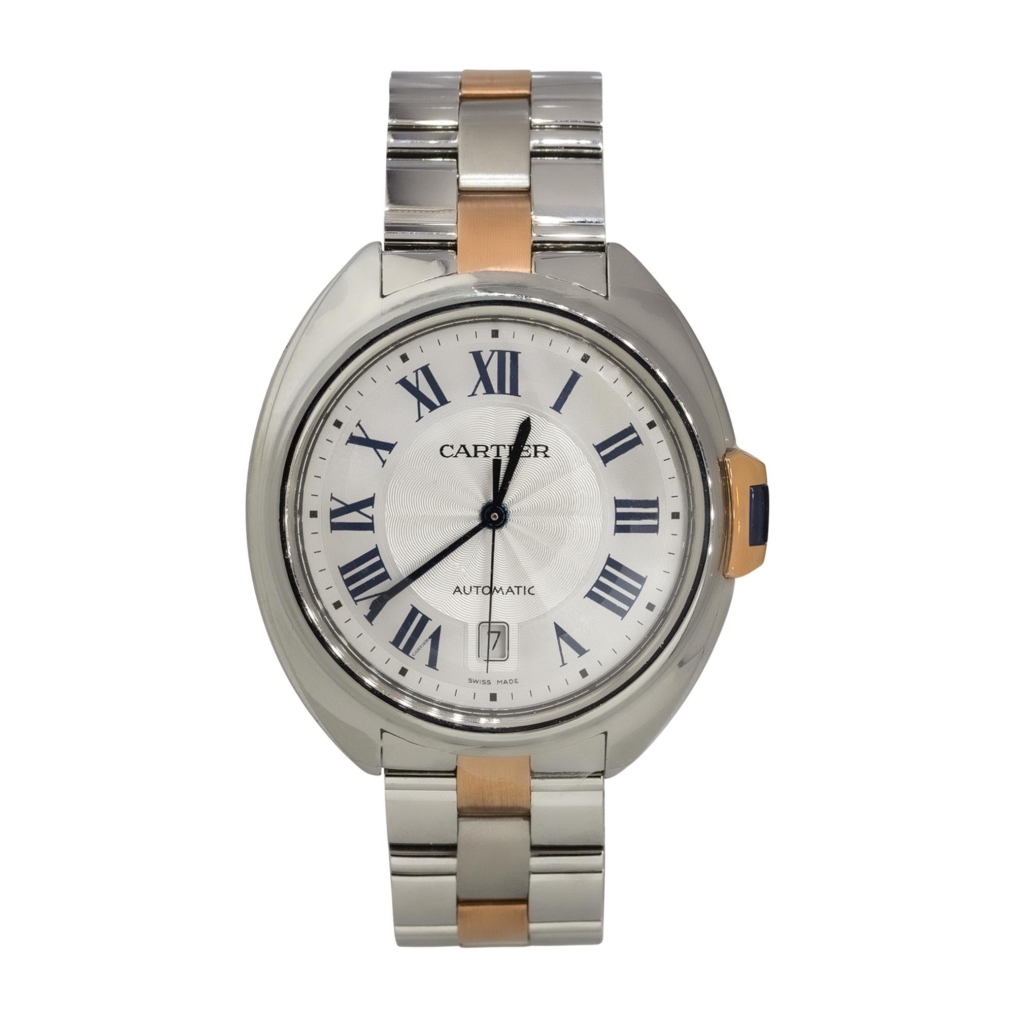 Brand: Cartier
Model: Clé de Cartier
Reference Number: 3850
Case Material: Stainless Steel & 18k Rose Gold
Dial: Silver dial with blue hands and black roman numerals. Date can be found at 6 o'clock
Bezel: 18k Rose gold smooth bezel
Case