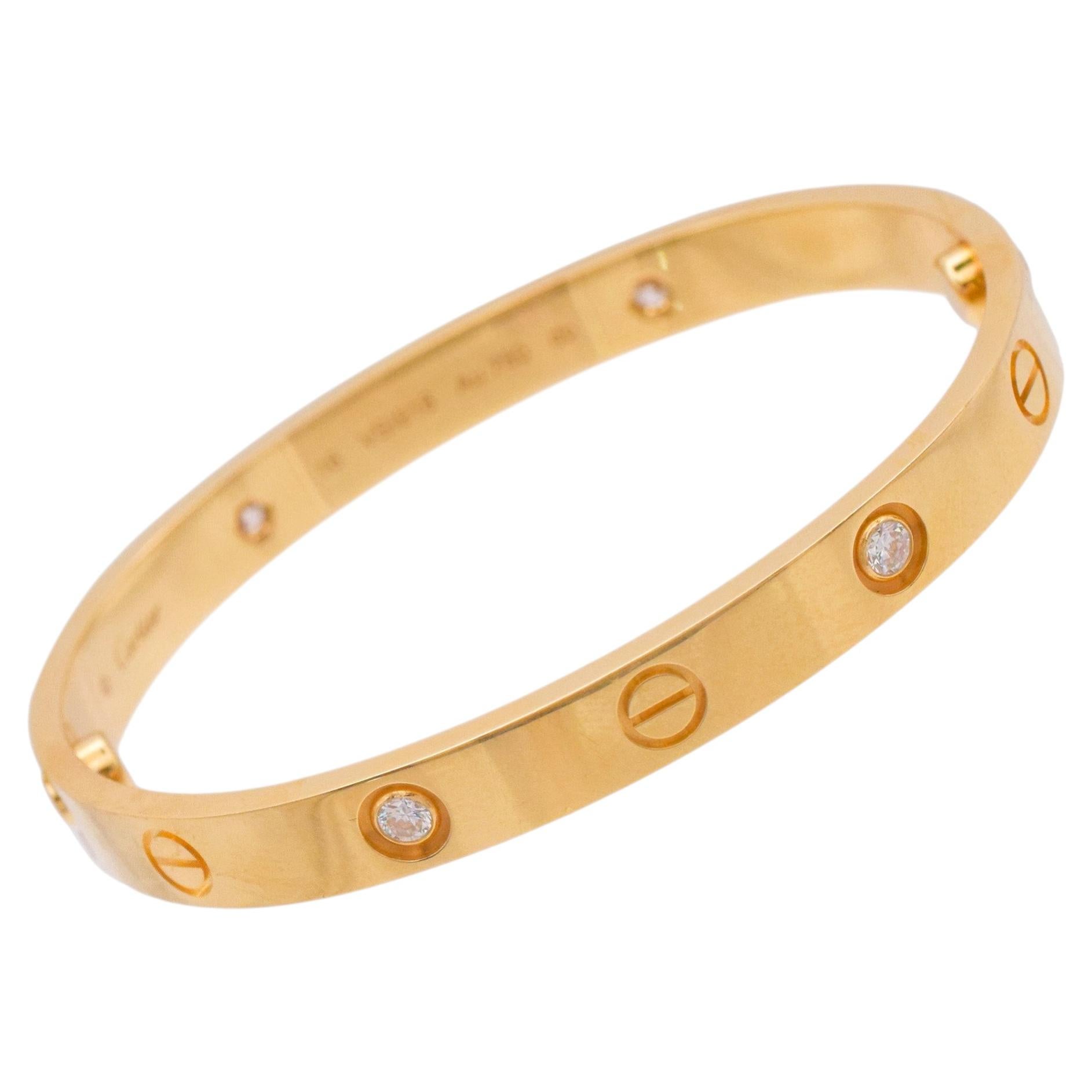 Bracelet rigide « Love » de Cartier, or jaune 18 carats, orné de 4 diamants