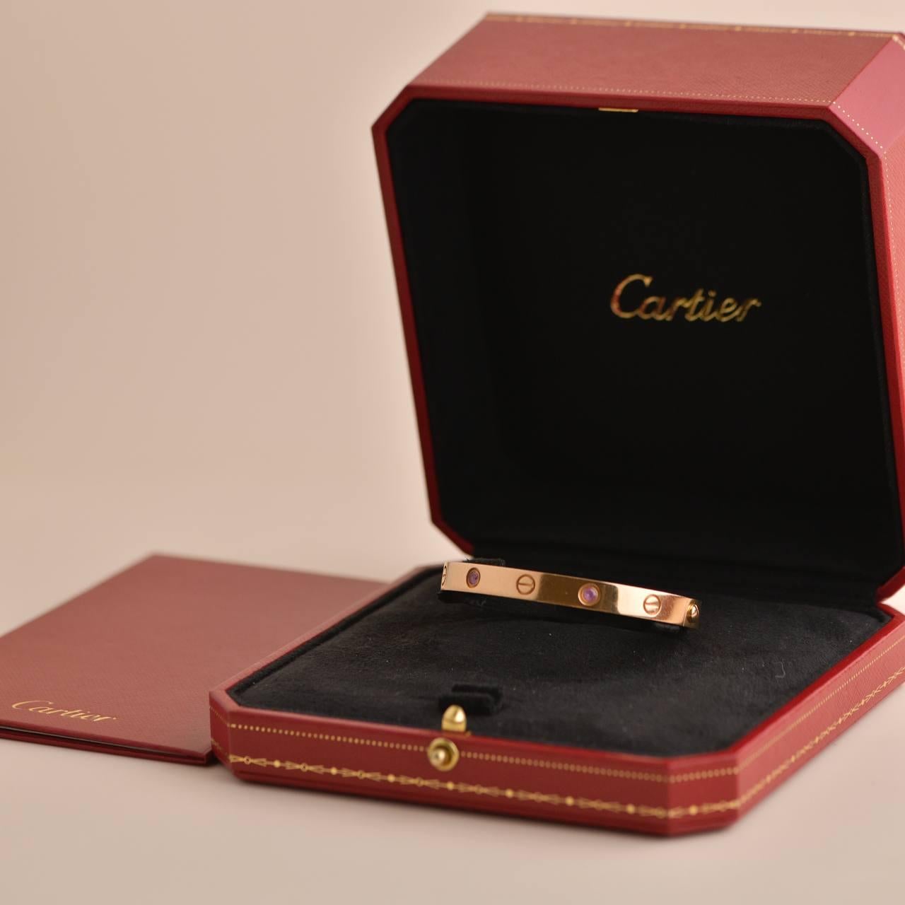 Dandelion Antiques SKU	AT-2068
Comes With	Full Set (Box + Card)
Date	Circa 2008
Model	B60311118
Serial Number	OW****
Size	16 Size Guide
Metal	18k Rose Gold
Stones	Pink Sapphire
Weight	31 g
Comes with Cartier Pouch / Dandelion Antiques Guarantee