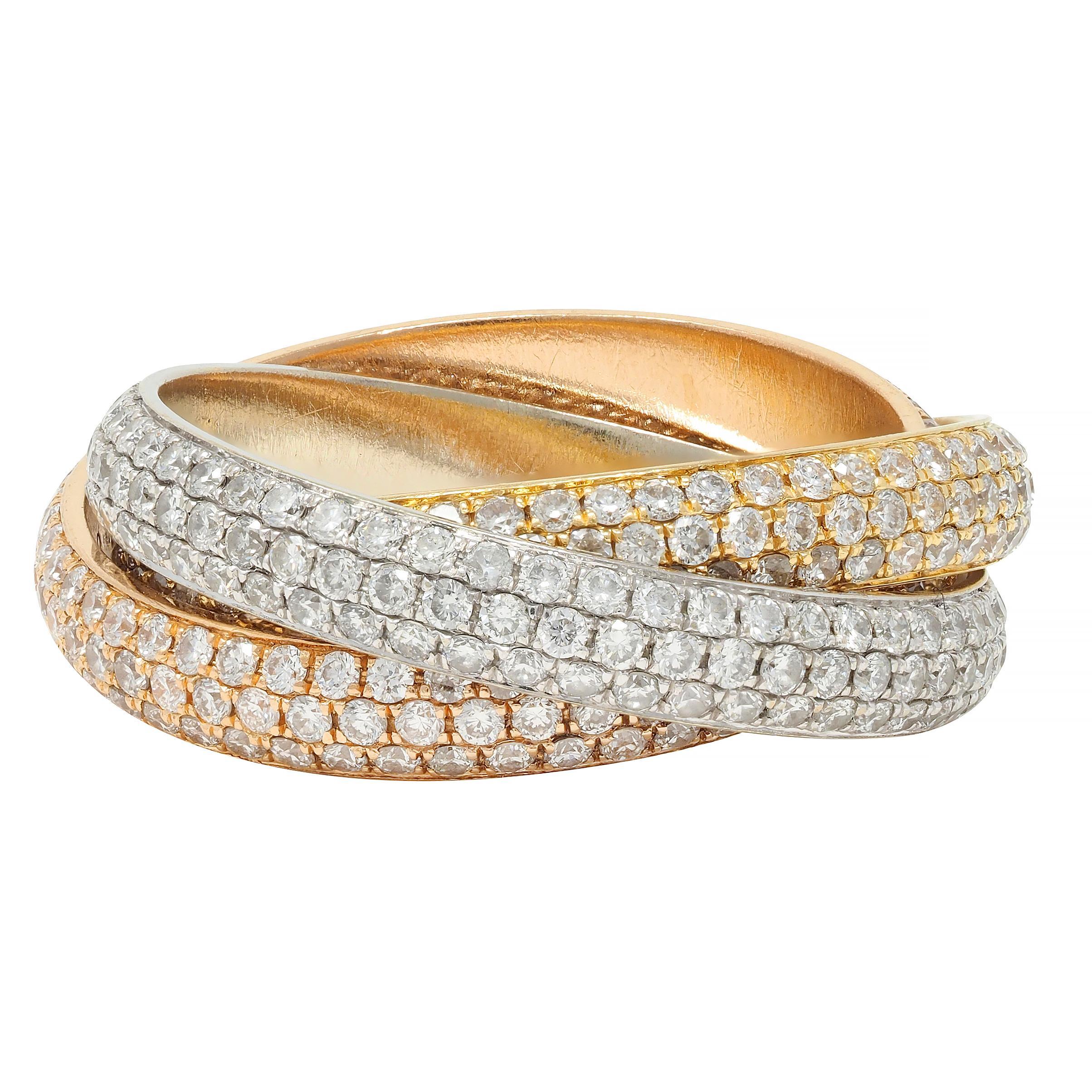 Designed as three interlocked bands of rose, yellow, and white gold
Pavé set throughout with round brilliant cut diamonds 
Weighing approximately 4.50 carats total - G color with VS1 clarity
Bands feature 