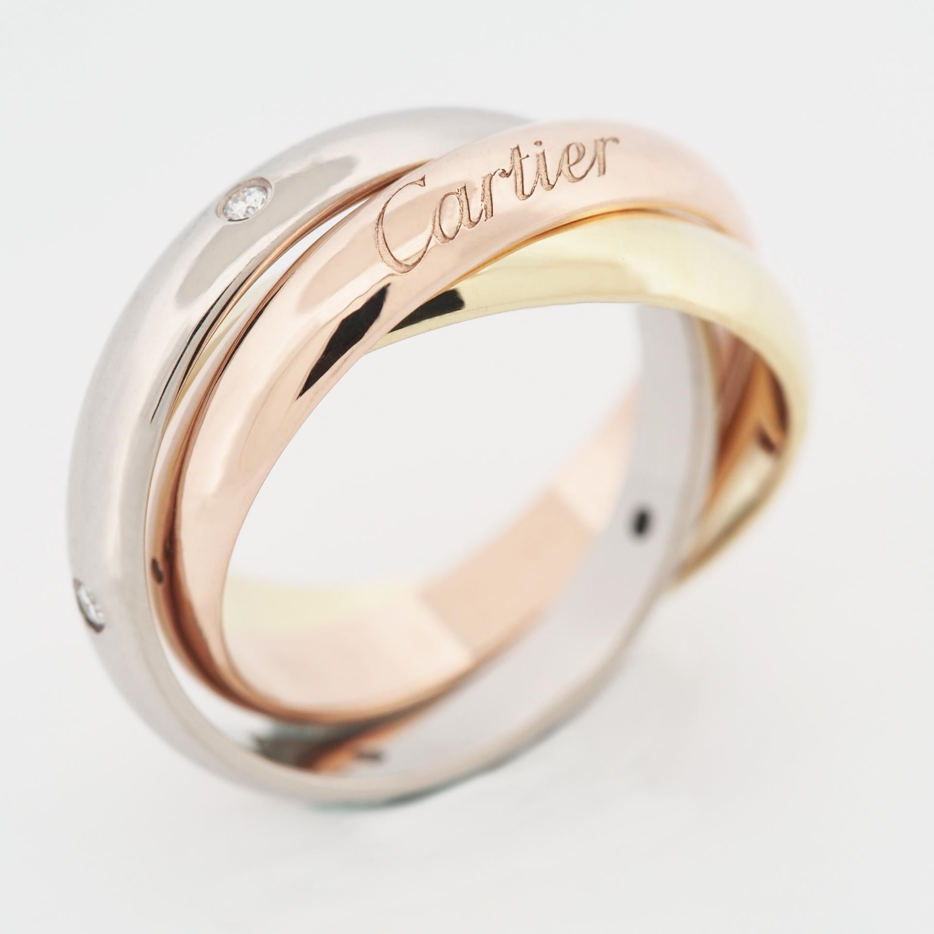 Item: Authentic Cartier Trinity Ring
Stones: 5 diamonds ( 0.04 carats )
Metal: 18K Yellow / Rose / White Gold
Ring Size: 51 US SIZE 5.75 UK SIZE K 3/4
Internal Diameter:  16.30 mm
Measurement:  3.5 mm
Weight:  10.0 Grams
Condition: Used