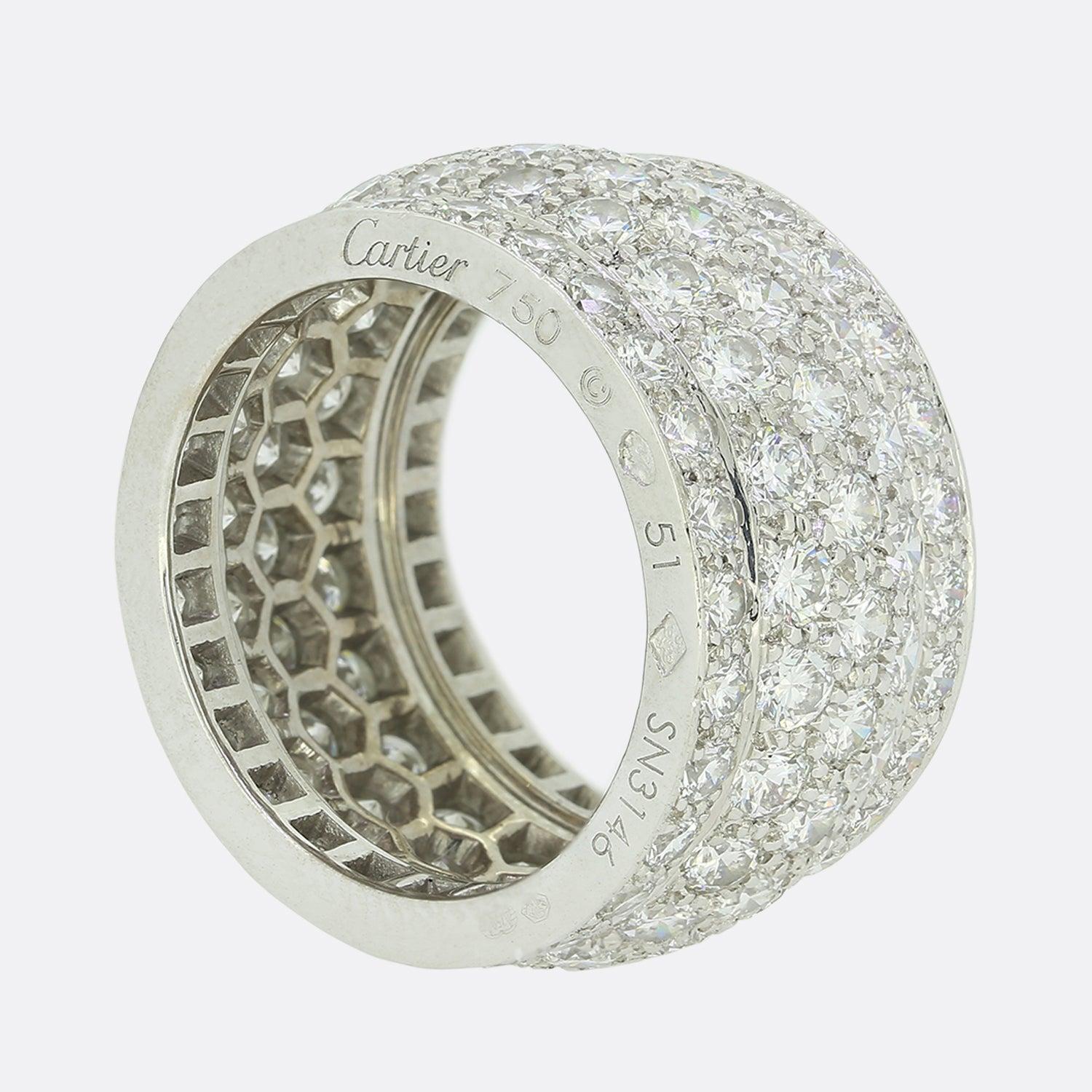 This is a beautiful pave diamond ring from the luxury jewellery designer Cartier. The design is recognisable as Cartiers Nigeria collection and has been pave set with 122 high quality round brilliant cut diamonds weighing a total of 5.50 carats and