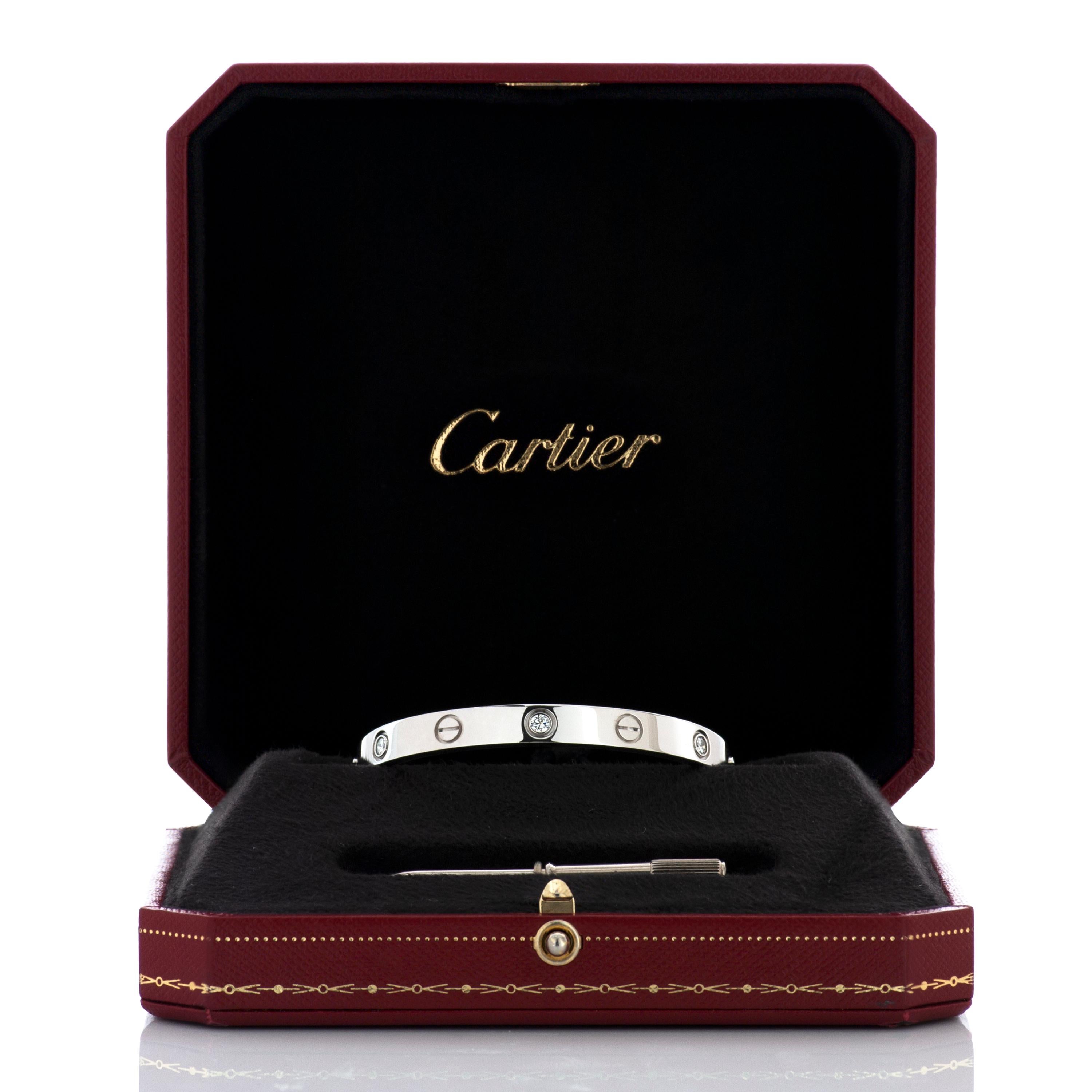 Cartier love bracelet featuring 6 round diamonds in 18k white gold, accompanied by screwdriver and Cartier box.

Size 16, 6.1mm wide.  

Numbered and signed 