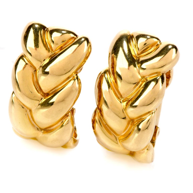 Select this classic Cartier Estate 18K Yellow Gold Braided Clip-On earrings as the next staple jewelry piece in your collection!

  These high-quality Cartier earrings are crafted in 18-karat yellow gold and display a fashionable braided design.