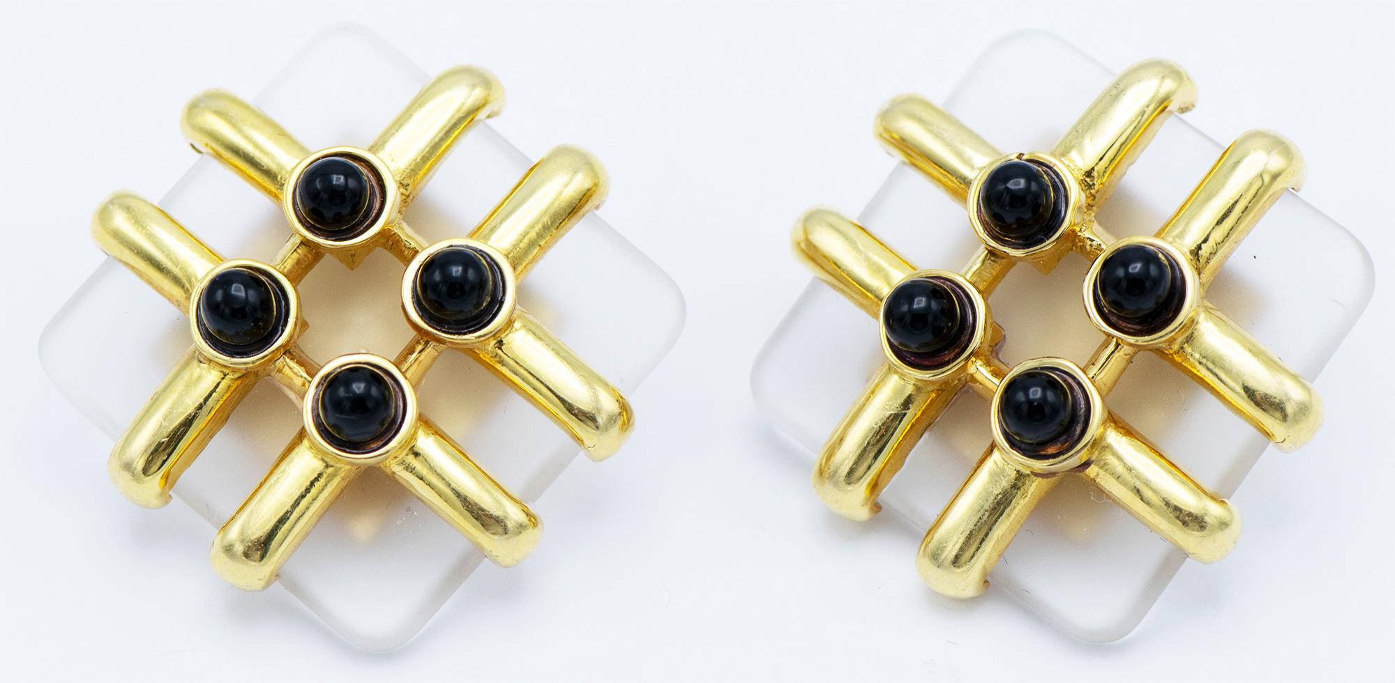  Cipullo Cartier Rock Crystal Earrings , each designed as a frosted rock crystal square, trimmed with sculpted gold and bisected cabchon black onyx. 
Metal: 18K Yellow Good
Stones: 8 Cabochon bisected black onyx stones  
