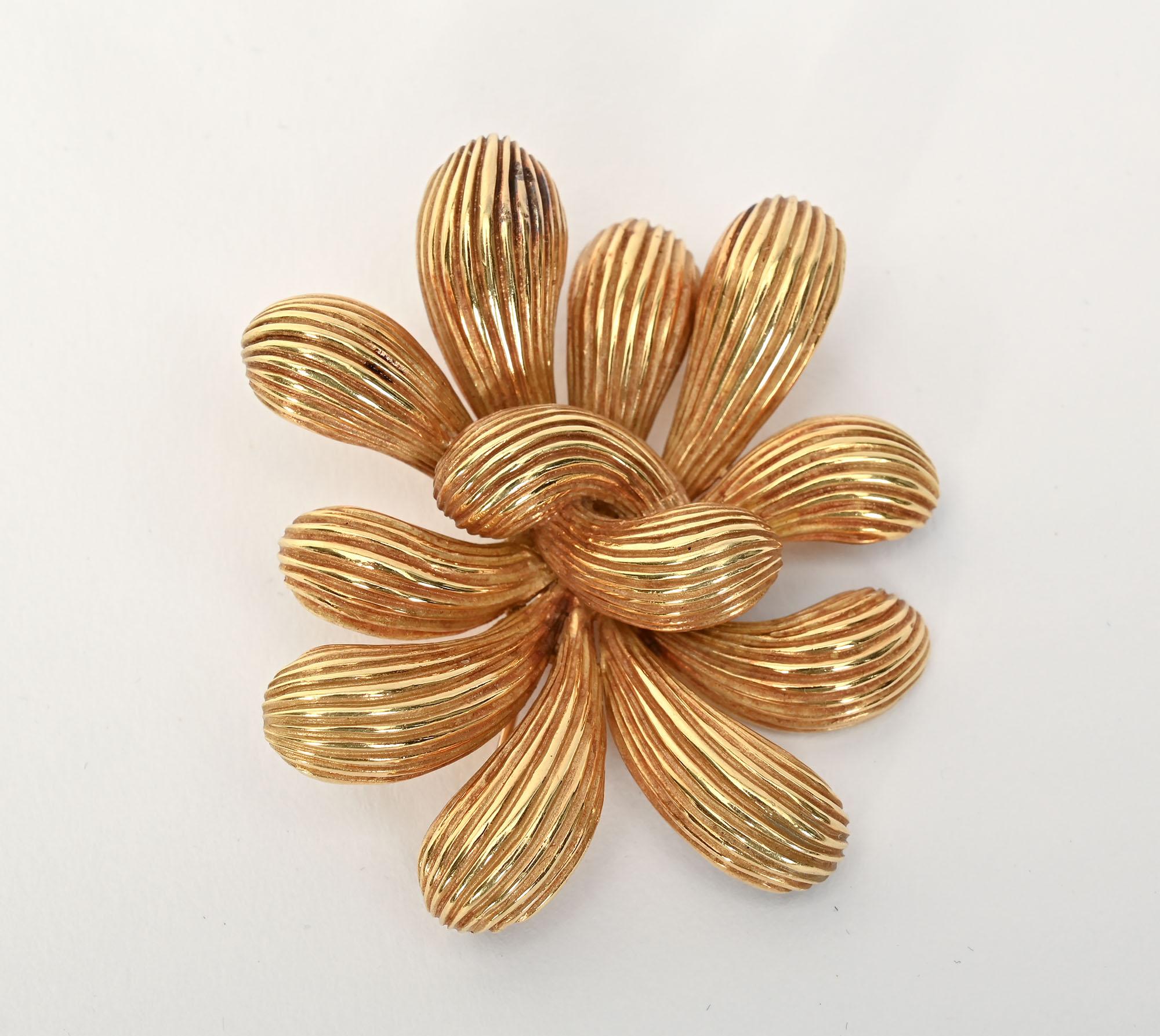 Cartier abstract form brooch with striated lobes going in different directions. It is nicely three dimensional. The brooch can be worn either vertically or horizontally. It measures 2 1/4