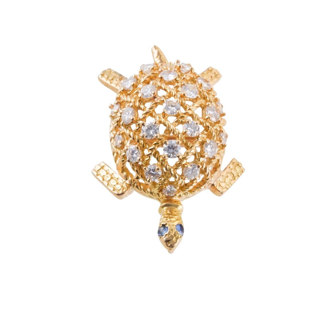 Adorable 18k gold Cartier turtle brooch, set with sapphire eyes and approx. 1.10ctw G/VS diamonds. Brooch measures 37mm x 25mm. Marked Cartier, 750.  Weight of the piece - 12.5 grams. 