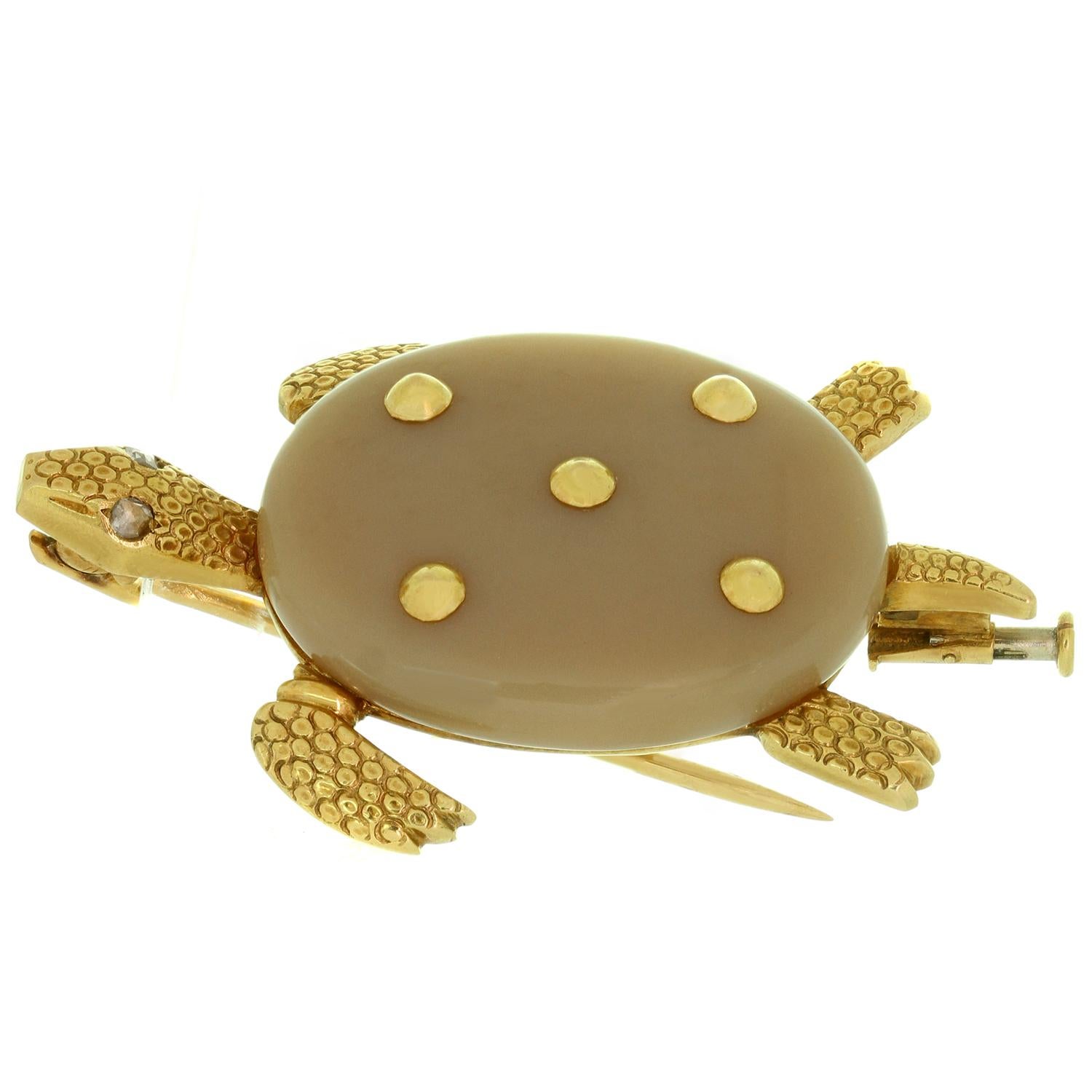 This fabulous vintage Cartier turtle-shaped brooch is crafted in 18k yellow gold and features shell made of agate, enhanced with five gold studs, a textured gold head, legs and tail, and accented with rose-cut 5cm diamond eyes. Completed with French