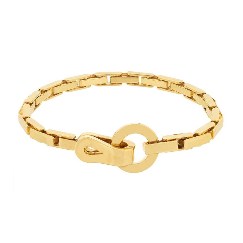 This lovely Cartier bracelet is from the 'Agrafe' collection. Crafted in lustrous 18 carat yellow gold, the craftsmanship is excellent. The total weight of the bracelet is 32.8 grams, and all original hallmarks and marking are present. 
Metal: 18ct