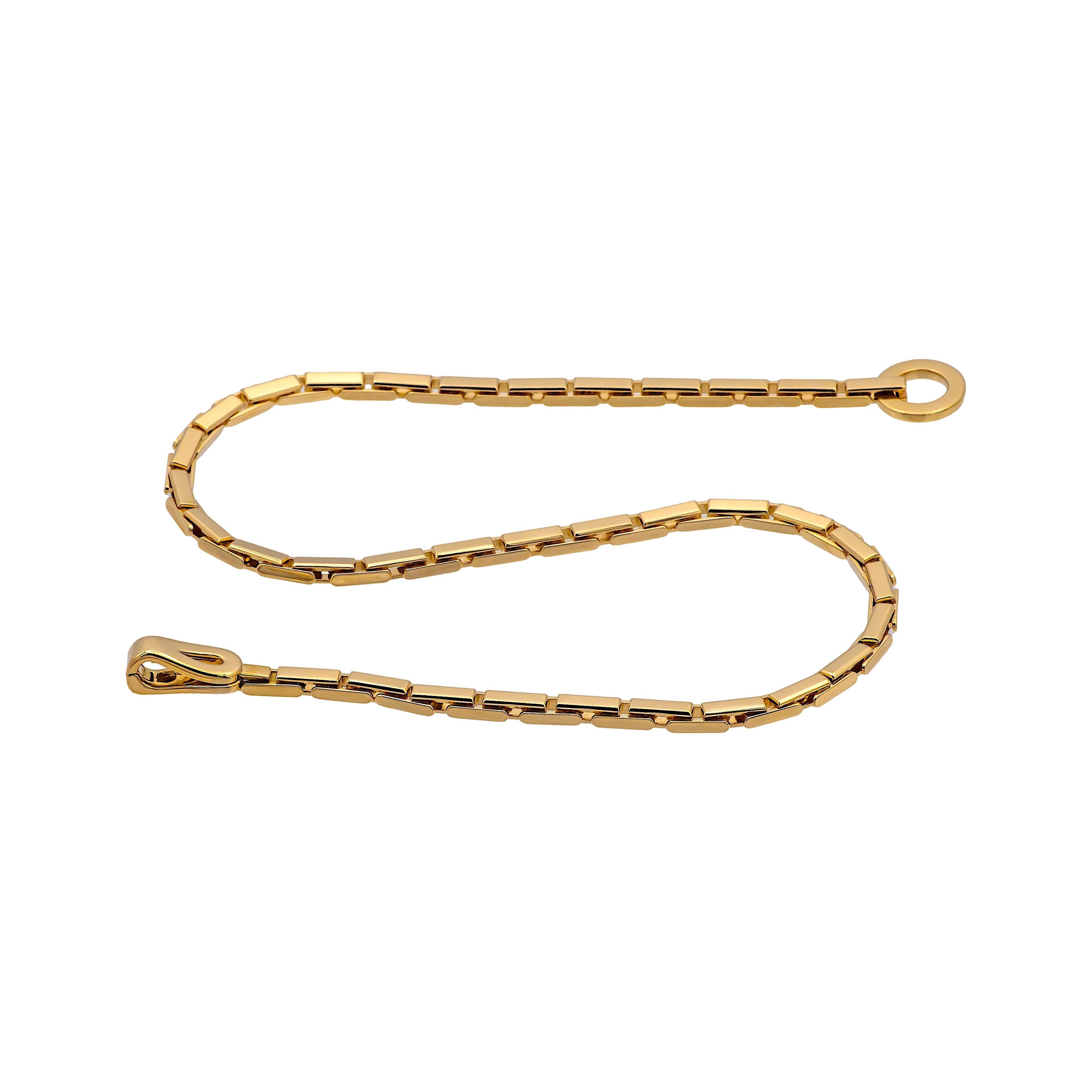 Pre-Owned Cartier gold necklace from the Agrafe collection finely crafted in 18 Karat yellow gold featuring a unique clasp consisting of a an open circle and hook closure. The necklace has the classic Cartier bar links measuring 3.6 mm wide and 16
