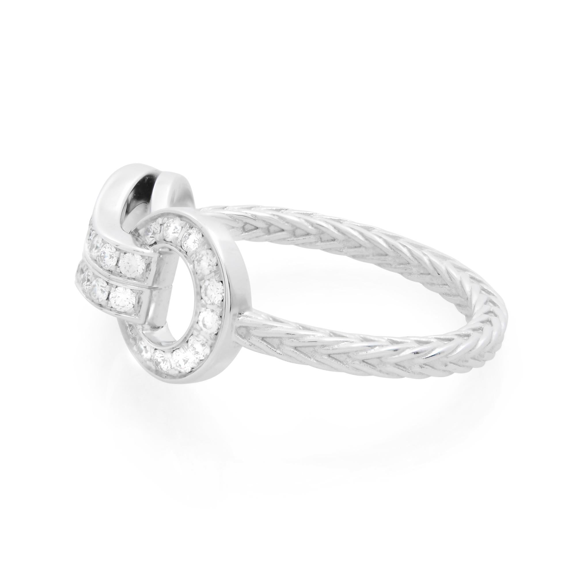 Cartier's 18K white gold diamond ring from Agrafe collection. Features 32 round cut diamonds. Total diamond carat weight: 0.23. Diamond color grade: colorless. Diamond clarity: very very slightly included. High polished metal. Hallmarked. Ring size