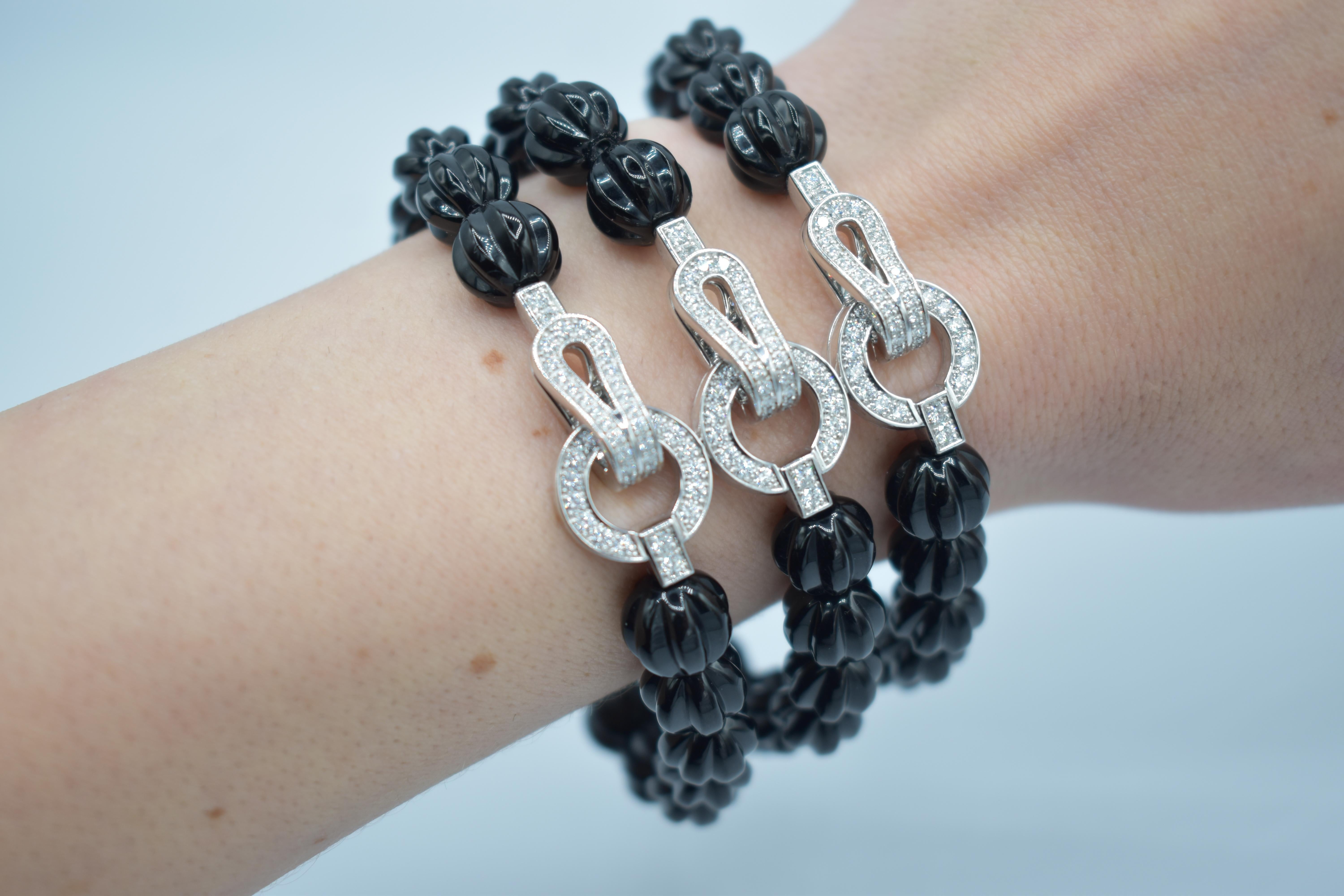 Elegance finds its perfect expression in this extraordinary Cartier Agrafe Diamond Onyx Bracelet. Crafted by one of the world's most renowned jewelry designers, this piece serves as a radiant testament to Cartier's iconic legacy and exquisite