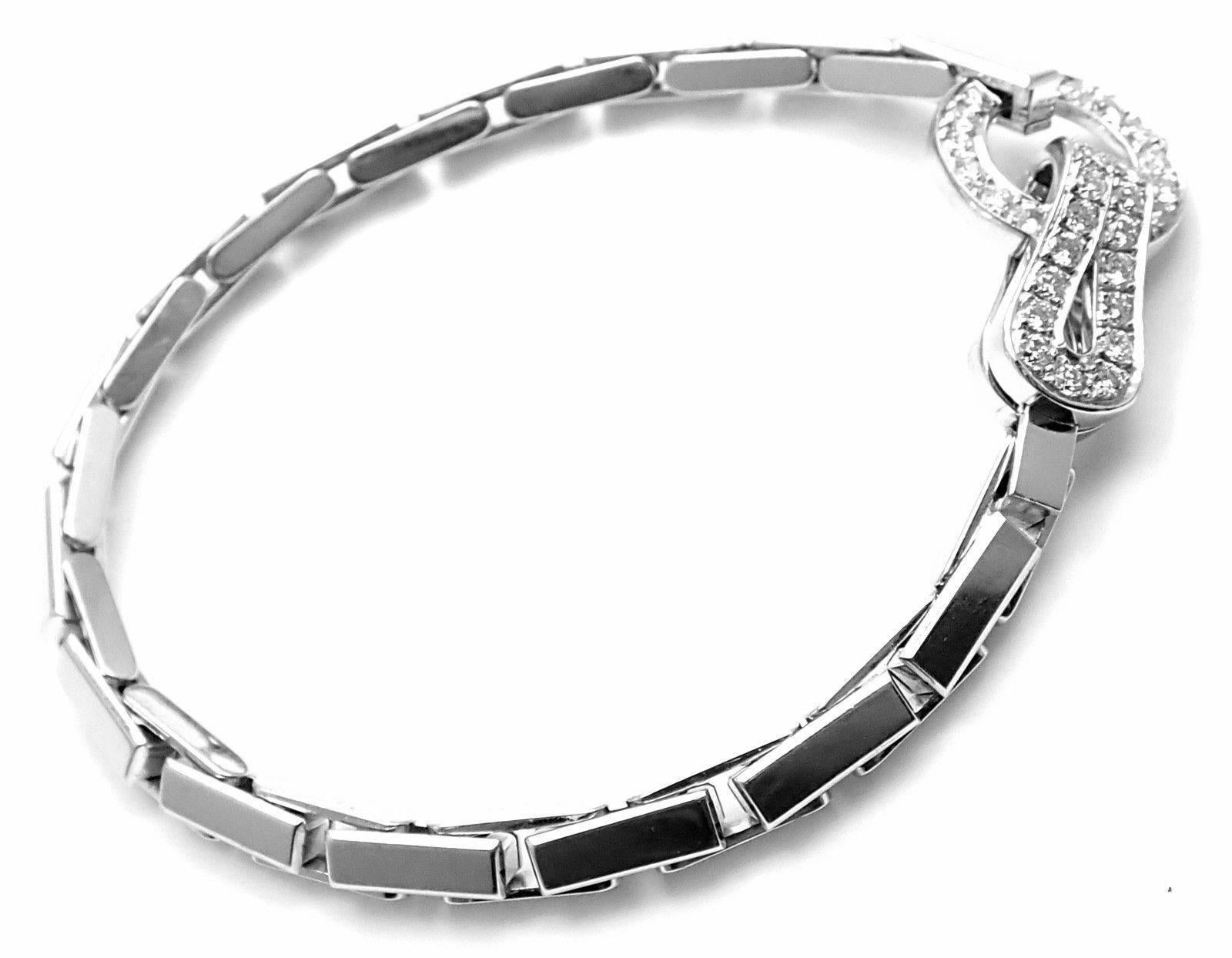 18k White Gold Diamond Agrafe Bracelet by Cartier.
With 35 round brilliant cut diamonds G color, VVS1 clarity total weight approx. 1.25ct
Details:
Length: 7 1/4
