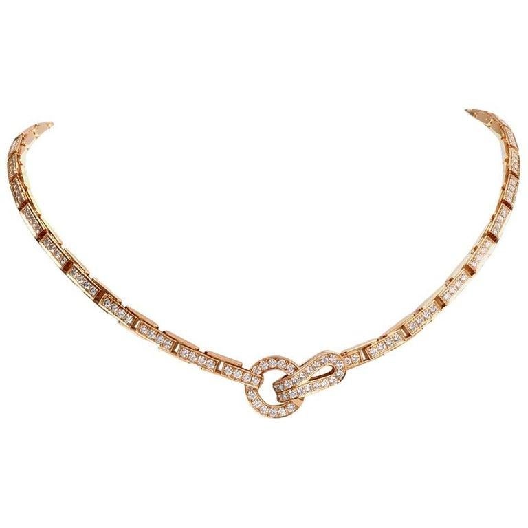 This iconic Cartier Agrafe necklace is crafted in 18-karat yellow gold, weighing 58.1 grams and measuring almost 17 inches long x 15mm max. width. The classically elegant choker necklace from the Agrafe collection (The word Agrafe in French meaning