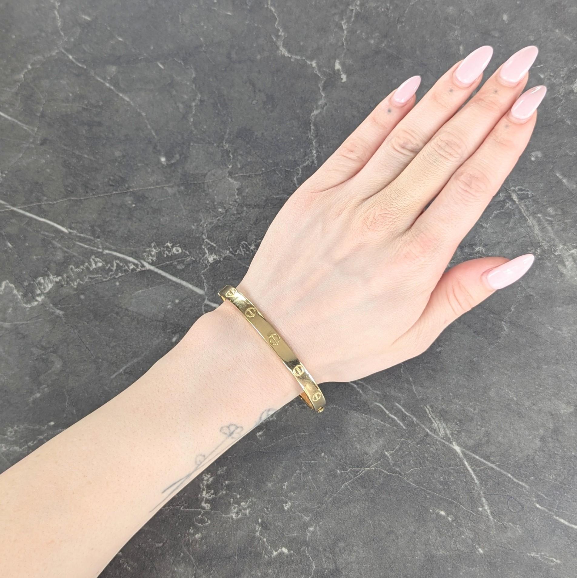 Designed as an oval shaped gold bangle
Engraved with iconic screw head motif
Inscribed 'my love, i am always...close to you. Valerie '71'
With a high polished gold finish
Opens via two removable screws
Stamped for 18 karat gold
Numbered and fully