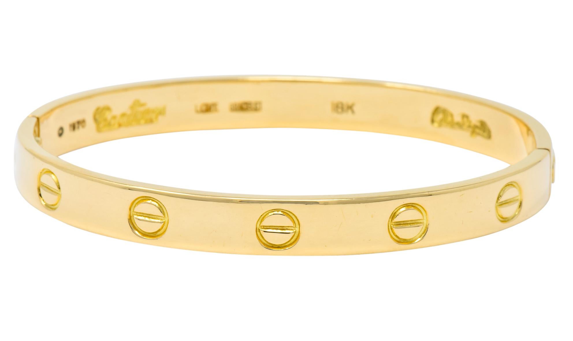 Featuring a high polished bangle bracelet of 18 karat rose gold

Accented with love symbol

Secured with screw closure on both ends

Fully signed 1970 Cartier Love Bracelet 18k Aldo Cipullo

Measures 6mm wide with 2.5mm thickness

Inner measurement: