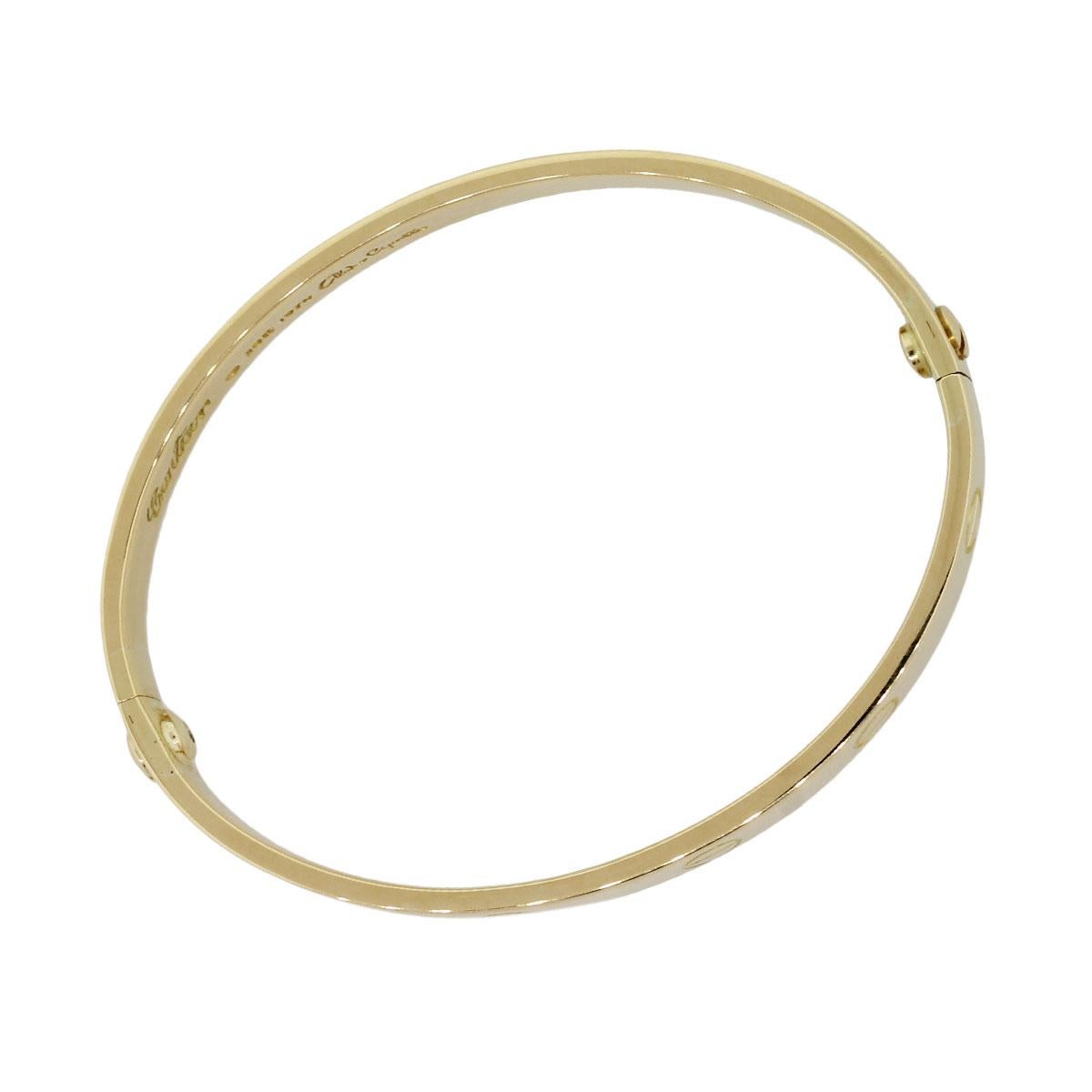 Designer: Cartier, Aldo Cipullo
Material: 18k yellow gold
Total Weight: 30.6g (19.7dwt)
Bracelet Measurements: Will fit a 6.25″ wrist, Cartier Size 16
Clasp Details: Screw
Additional Details: Item comes complete with a presentation box!
SKU: G8628