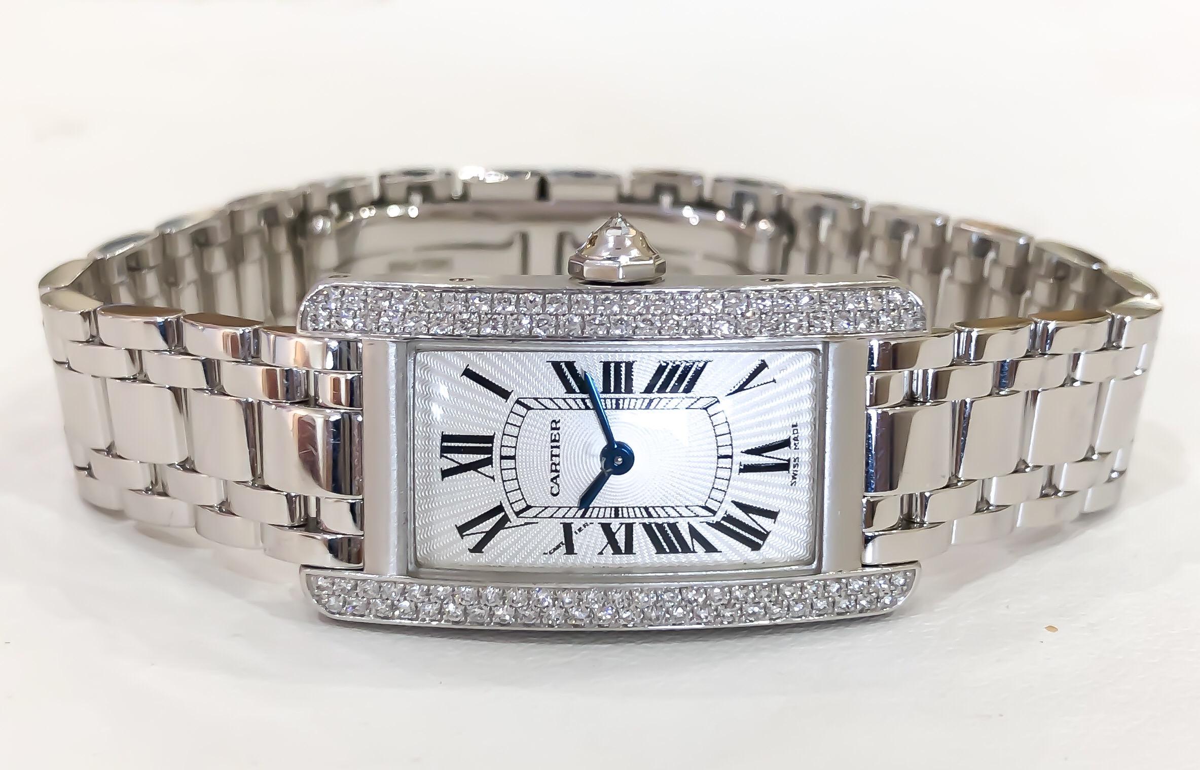 Lady's Cartier Small Americaine Diamond Tank 18K White Gold .85ctw comes with box, papers, extra link. All diamonds are factory set by Cartier.

•REFERENCE NO: 2489
•MOVEMENT: QUARTZ BATTERY
•CASE MATERIAL: SOLID 18 KARAT WHITE GOLD
•CONDITION: LIKE