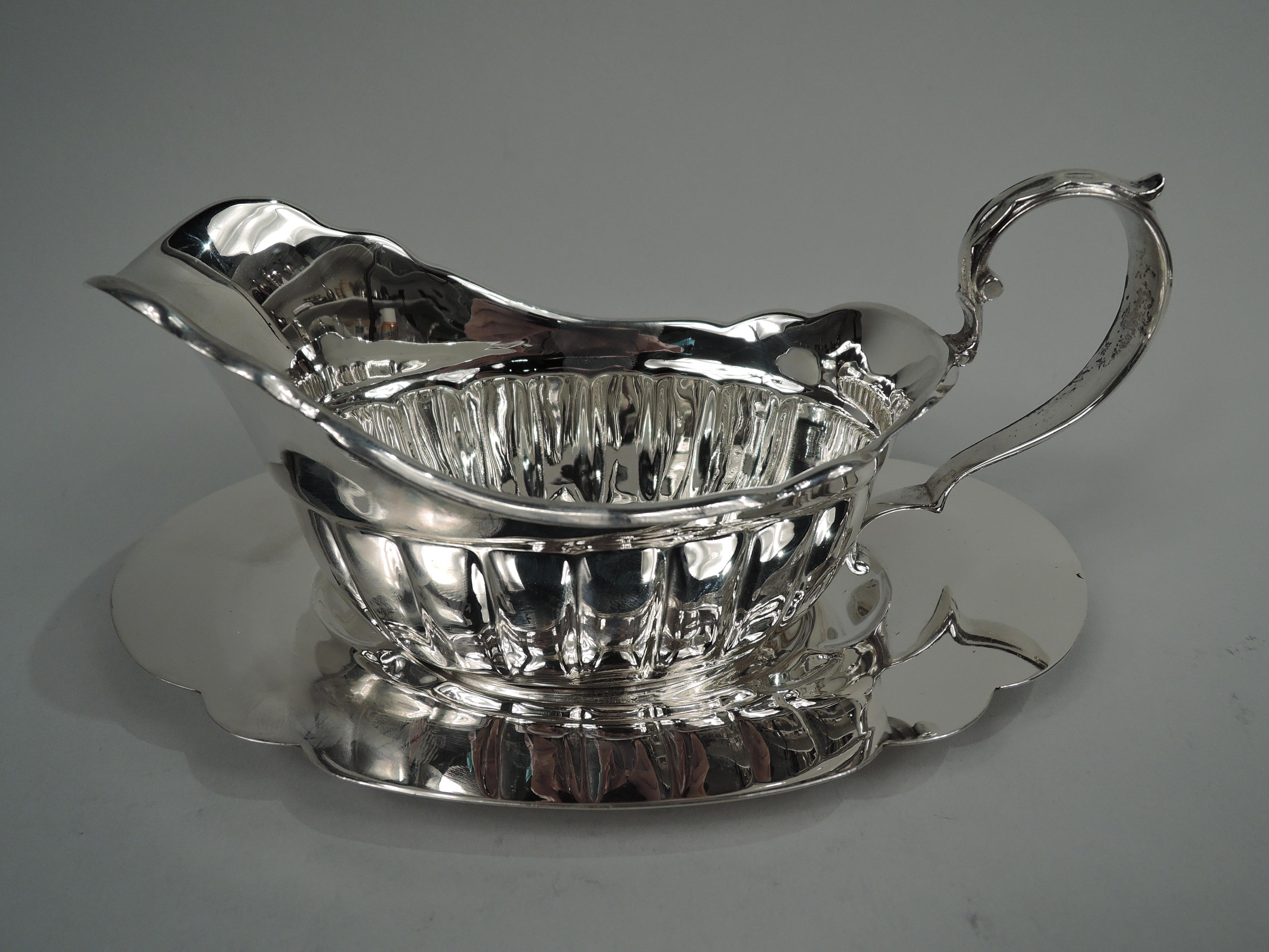 antique silver gravy boat with stand