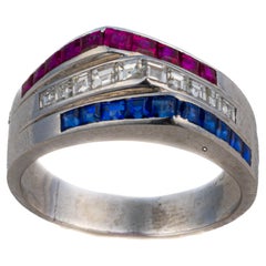 Anello Cartier "Americana" con rubino, zaffiro e diamanti